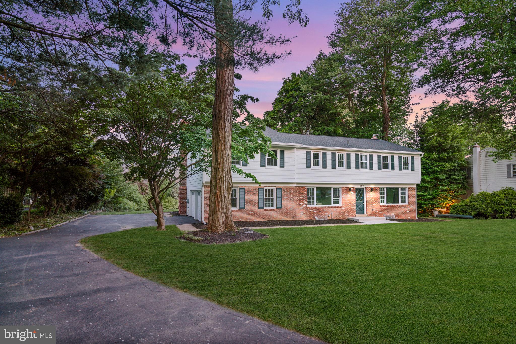 An expertly renovated forever home ready for its new owners, 250 Gulph Hills Rd is a 4 bed, 3.5 bath classic colonial that has been transformed into a modern residence brimming with unique character and architectural details. Its thoughtfully designed layout offers over 3,600sqft + a 700sqft finished basement, flexible living spaces on the main level, and a hotel-like primary suite, in addition to the property's .5+ acres of land and placement in the top-rated Upper Merion Area School District. Picturesque curb appeal is on display out front, where mature trees dot the lawn, and a driveway leads from the quiet road to the 2-car garage tucked on the side of the home. To the right of the entry foyer, the large living room is bright and airy, with tons of natural light pouring in from two sets of windows. To the left is a sunlit dining room with plenty of space to entertain. At the center of the home is a gleaming gourmet kitchen that's sure to be the family's main hub. It's fitted with custom white cabinetry, THOR stainless steel appliances, quartz counters, a tile backsplash that ascends behind the range hood, and a navy blue island with seating and pendant lights overheard. Thoughtful touches include a pot-filler over the range, under cabinet lighting, and dual arches that create a seamless transition to the dining room and the sun-soaked family room at the rear. A distinctive powder room off the kitchen and a den with a wet bar and a mudroom from the backyard complete the main level. More living space can be found in the huge finished basement, perfect for a home theater, gym, hobbies, and storage. Up on the second level, tall cathedral ceilings frame the palatial primary suite, where you'll find multiple closets, a separate sitting or dressing room, and a terrace overlooking the backyard. The luxurious ensuite is adorned with designer tile, a double vanity, a soaking tub, a glass-enclosed shower, and a water closet. Down the hall, there's a large secondary suite with an attached bathroom, two more bedrooms, and a third full bathroom. In addition to everything inside, the sprawling backyard and patio is the ideal place to host barbecues, garden, and play outdoors. 250 Gulph Hills Rd's fantastic location is just off S Gulph Rd, providing easy access to Radnor, Villanova, Conshohocken, King of Prussia, I-76, and I-476. Schedule your tour today!