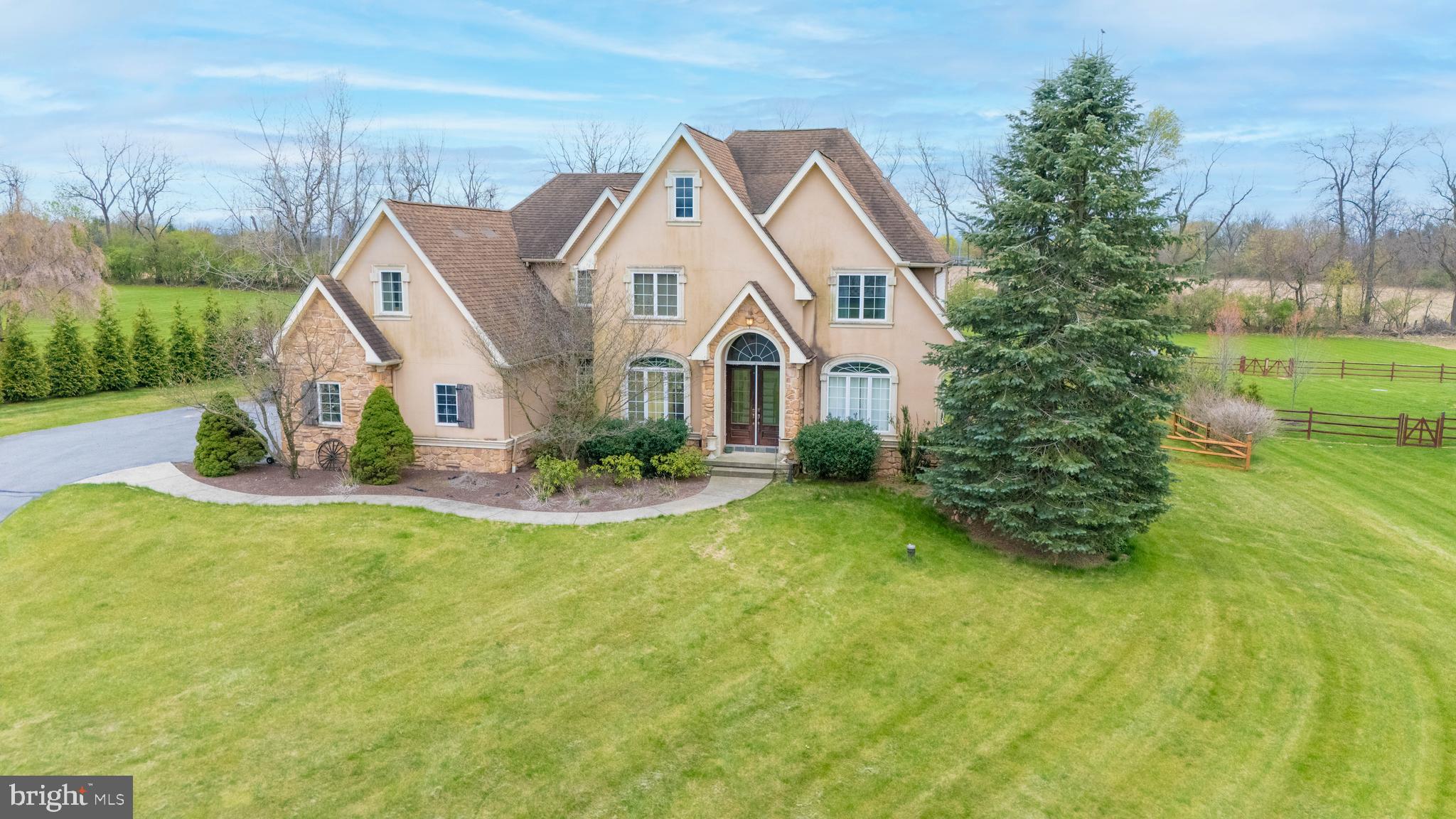 Welcome to your dream home in the highly sought-after Nazareth School District! Situated on a quiet cul-de-sac, this impressive 5-bedroom, 2.5-bath home greets you with illuminated stone pillars and a curved driveway that sets the tone for the elegance inside. The heart of the home is the spacious kitchen, featuring granite countertops, stone accents, tall cabinetry, and a large center island—ideal for everyday living and entertaining. A private den with French doors provides the perfect space for a home office or study, while crown and picture frame moldings add timeless detail throughout. Upstairs, you’ll find four generously sized bedrooms, including a luxurious master suite with a tray ceiling and an adjoining retreat—ideal as a nursery, home office, or private lounge. The master bath offers a relaxing Jacuzzi tub and plenty of space. The finished basement adds even more living space with a family room, a recreation room, and a fifth bedroom—perfect for guests or extended family. Step outside to a 25x26 stone patio, perfect for hosting gatherings, along with a partially fenced backyard. A 3-car garage and extended parking pad offer plenty of room for vehicles and storage.