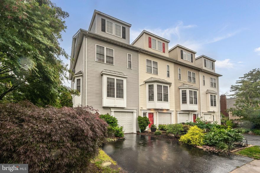 Get ready to fall in love with this stunning 4-bedroom, 3.5-bath end-unit townhouse in sought-after Arlington Heights! With 2,430 finished square feet, a private fenced yard, and gorgeous indoor-outdoor living spaces, this home delivers the perfect blend of comfort, style, and location. Step inside and feel the warmth of sunlight streaming through oversized windows, bouncing off gleaming hardwood floors, and highlighting elegant crown molding and chair rail details. The open-concept living and dining area is perfect for entertaining or a cozy night in, complete with a charming bay window nook. The updated kitchen is a dream, featuring granite countertops, stainless steel appliances, ample cabinet space, and a bright eat-in area. Whether you're cooking for a crowd or enjoying a quiet morning coffee, this space checks every box. Upstairs, unwind in the spacious primary suite with dual closets and a luxurious renovated bathroom boasting a glass-enclosed shower, double vanity, and shower seat. A second bedroom also offers an en-suite bath—perfect for guests, roommates, or a home office setup with privacy. Downstairs, the fully finished basement brings serious bonus space with a cozy fireplace, full bath, and easy walk-out access to your deck, patio, and yard—complete with playset and room to roam! The large laundry room with utility sink makes everyday chores a breeze. Top it all off with a paved driveway, end-unit privacy, and a vibrant walkable neighborhood just minutes to Metro, shopping, dining, parks, and everything Arlington has to offer. This is more than a home—it’s a lifestyle. Don’t wait,  tour 414 S Wayne St today and make it yours!