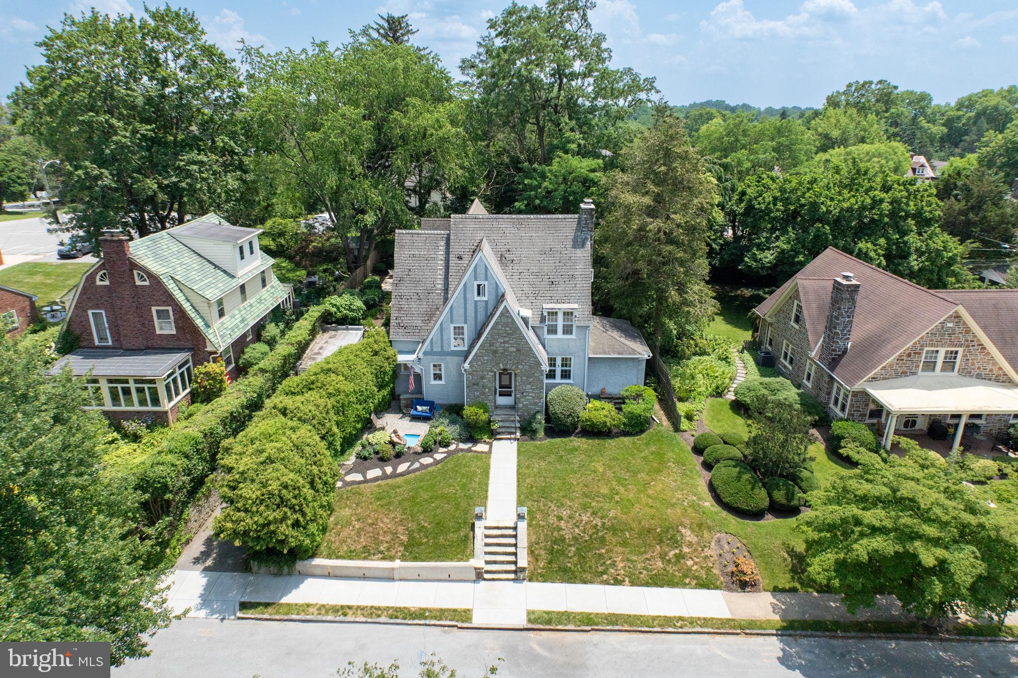 ‘One-of-a-Kind’ Stone Single on WONDERFUL Dean St in West Chester Boro! Lives larger than it looks! Comfortable & Cozy yet Exceedingly Spacious! 2500Sqft Addition – 2001: Old World Charm & Craftsmanship melded with 21st century amenities. c1929 4405sqft + 595sqft Lower Level 5Bedrooms 4.3Baths .27acres Absolutely Awesome Architecturals Expansive Hardscapes Mature Shade & Sun-Drenched Yard Main Level: Foyer, Powder Rm, Living Rm: WoodBurning Fireplace, French Doors Open to the Study/Den: Cathedral Ceiling & Entry to the Backyard, Outstanding Custom Kitchen/Dining Area OPEN to the Fabulous Family Rm: Powder Rm, Window Seats, GAS Fireplace, Double Atrium Doors to the Gracious Terrace, ‘Sport’s Court’ & Fenced Yard, both the Kitchen & Family Rms have Mud Rms. Upper Level1: Stunning Owner’s Suite: Cathedral Ceiling, Walk-in Closet, EnSuite Bath PLUS a Loft/Office Overlook, Laundry Room, Bedroom2 w/EnSuite Powder Rm, 2Additional Bedrooms, Hall Bath. Upper Level2: Petite Retreat: Bedroom5, Shower Bath AND Green! Walk-out Lower Level: Bonus Rm, Shower Bath, Exercise Rm + Storage. whew!!! What a house! Photos do not do this home justice, come discover the magic of our Boro Life Style!