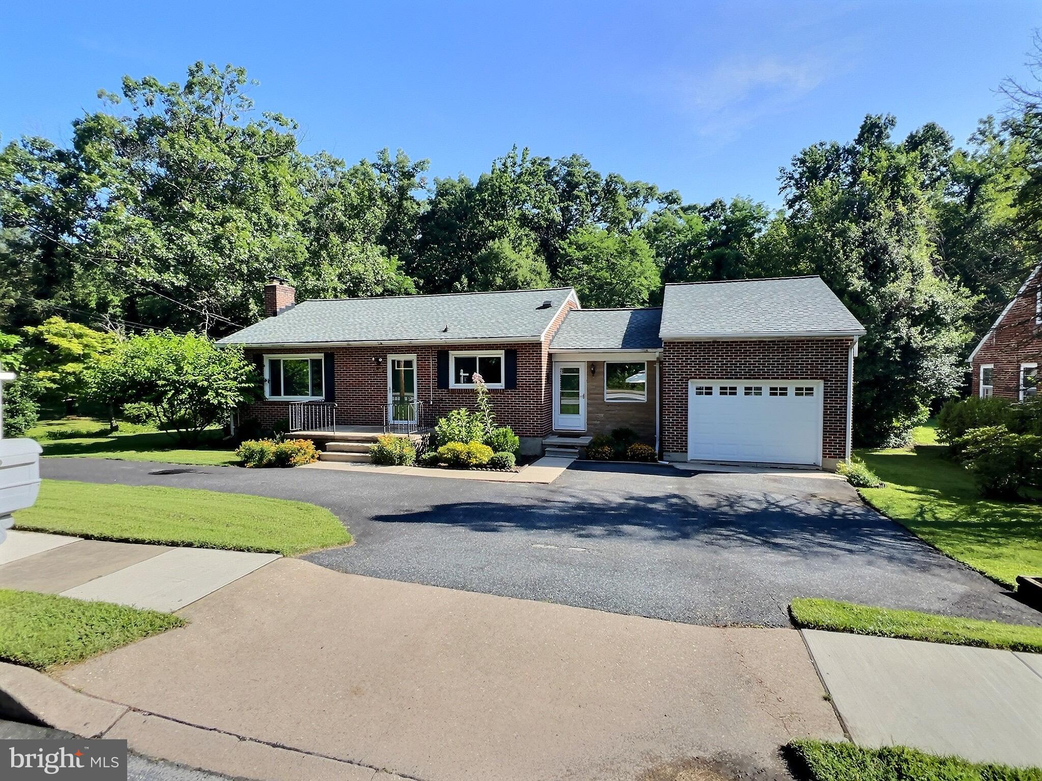 Nestled on a beautifully flat and private lot surrounded by mature trees, this home offers a peaceful retreat with excellent outdoor space. Enjoy ample parking with both a circular driveway and a secondary drive leading to an attached garage—ideal for any car enthusiast. The garage features a loft for extra storage and a built-in service pit, perfect for easy vehicle maintenance. Inside, you'll find 2BD/2FB and a fully finished basement offering versatile living space. Conveniently located just minutes from White Marsh Mall, CCBC, and I-95.