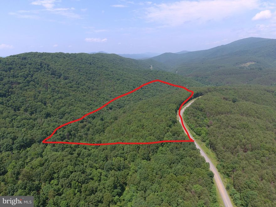 NEED TO BE IN THE COUNTRY BUT NEED CONVENIENT LOCATION?.....20 WOODED ACRES ONLY 3/4 OF A MILE OFF 4 LANE SUPER HIGHWAY BEHIND SECURE GATE IN THE PRETIGIOUS 10,000 ACRE MOUNTAIN COMMUNITY OF ASHTON WOODS. HUGE FLAT BUILDING SITE, HARDWOODS & PINES WITH SMALL MOUNTAIN STREAM AND TRAILS....FIBER INTERNET AVAILABLE, POWER & PERKED.....HUNT, SHOOT, CAMP.....BUILD YOUR WEEKEND GETAWAY OR FULL TIME HOME......ONLY 5 MINUTES FROM MOOREFIELD.....WAL MART, SCHOOLS, RESTAURANTS, THEATER.....40 MINUTES FROM SKI RESORTS....10 MINUTES FROM MULTIPLE ACCESS POINTS ON THE SOUTH BRANCH OF THE POTOMAC RIVER......30 MINUTES FROM WORLD CLASS TROUT STREAMS AND 10'S OF THOUSANDS OF ACRES OF THE GEORGE WASHINGTON NATIONAL FOREST.....COMMUNITY OFFERS PRIVATE ACCESS POINT TO NATHANIEL MOUNTAIN WILDLIFE MANAGEMENT AREA, 10,000 ACRES OF PUBLIC HUNTING & HIKING......ALL OF THIS WITHIN AN EASY 2 HOUR DRIVE FROM NORTHERN VIRGINIA......EASY PRETTY DRIVE.....RIDE YOUR HARLEY OR FERRARI TO THIS LAND. MINIMAL INFRASTRUCTURE COSTS ON THIS LOT, IT DOESN'T REQUIRE A LONG STEEP DRIVEWAY OR LONG PULL FOR ELECTRIC....JUST HIT THE EASY BUTTON AND BUY IT....THIS ONE'S A NO BRAINER!