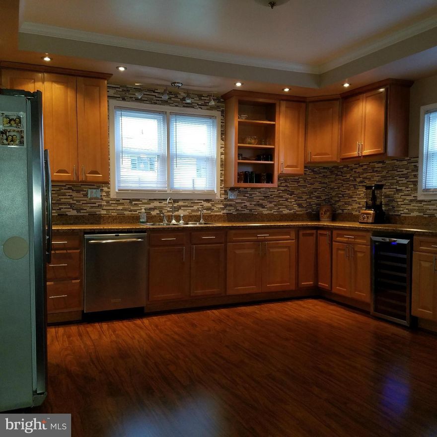 Attention all Buyers...If you are looking for the modern touch, look no further!! This 3 bedroom. 2 1/2 Bath  home situated on a .25 acre lot in the city limits. Stainless Steel Appliances,Wine Fridge, Main Level laundry,Master Bedroom with Bath, Laminate flooring and W/W carpet, replacement windows thru-out. This home is move in ready!!