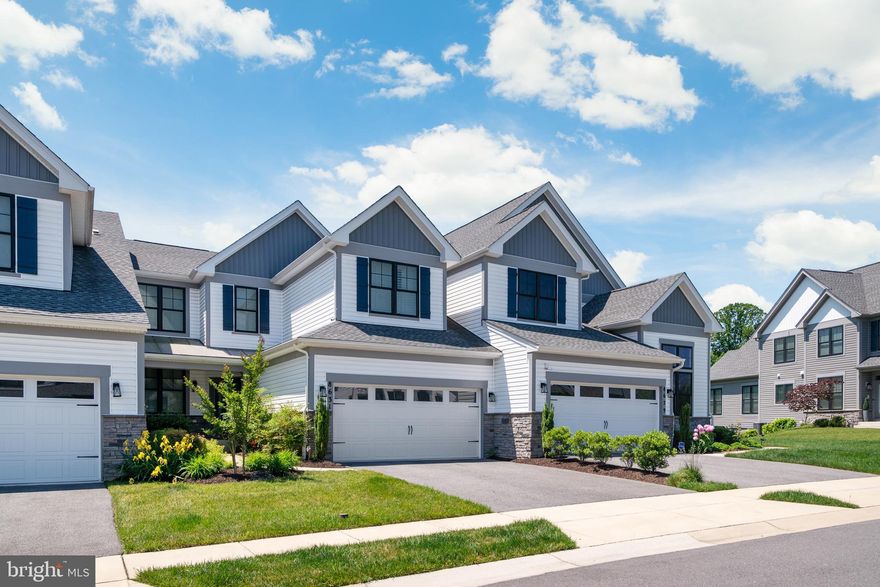 Luxurious and stunning home awaits you!  Open-concept floor plan on main level featuring separate dining room, great room with vaulted ceiling, gourmet kitchen with granite counters, stainless steel appliances, pendant lighting over large island and  gas range with hood.  Gleaming wood floors and neutral paint create a chic feel throughout this home.  Main level primary bedroom suite with double walk-in closet, attached bathroom with separate shower and tub plus dual sinks.  Laundry room with dual entry from primary bathroom and hallway for easy access.  The upper level sanctuary has a bedroom with an ensuite bathroom, plus 2 additional bedrooms with a hallway full bathroom.  Lower level family room is spacious with large storage area and walkout to rear yard.  Spacious attached garage and beautiful landscaping complete the home.  The community clubhouse with a beautiful pool adds to the charm of this neighborhood.  Conveniently located  to  Ft. Meade,  Annapolis, D.C., Baltimore, shopping, schools, restaurants, major highways,  This home has it all!  Home and carpet will be professionally cleaned.  Tenant occupied with at least 24 hour notice required.