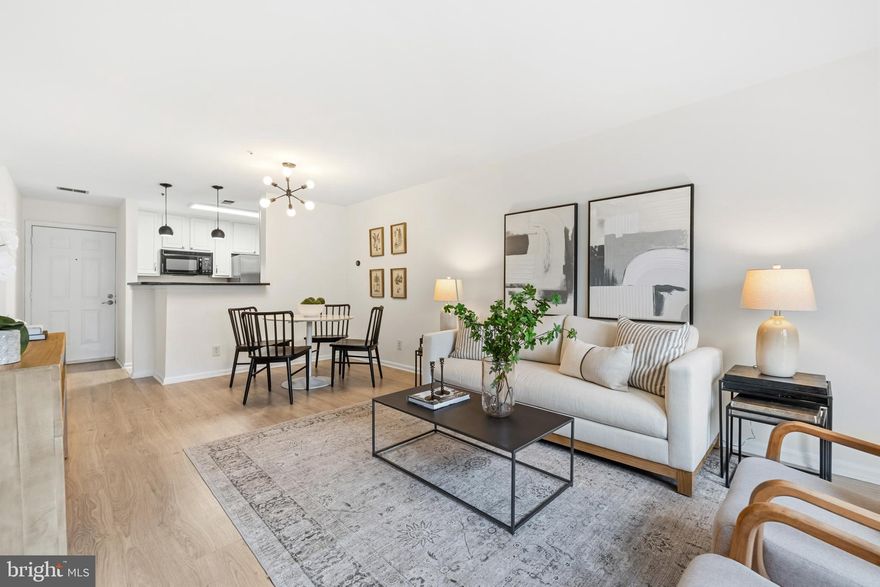 Tucked into the peaceful Four Winds at Oakton neighborhood, this light-filled one-bedroom condo offers easy living in an unbeatable Oakton location. The open layout creates a natural flow between the kitchen and living area, making the space feel comfortable for both quiet evenings at home and hosting friends. Step outside to your private patio, the perfect spot for morning coffee, fresh air, or unwinding at the end of the day. Inside, the spacious primary bedroom features a walk-in closet that provides generous storage, while the in-unit washer and dryer add everyday convenience. Parking is abundant with two parking lot tags and an additional visitor parking tag. Additional parking is available on the street. Condo fee includes water utilties. Residents also enjoy access to community amenities including a pool, exercise room, and dog park. Location is where this home truly shines. Just two miles from the Vienna Metro and with quick access to I-66, commuting into Tysons, Arlington, or DC is simple. Shopping, dining, and everyday essentials in Oakton are just minutes away. Updates: 2026 - LVP flooring, carpet, paint, 2018 - electric panel replaced.