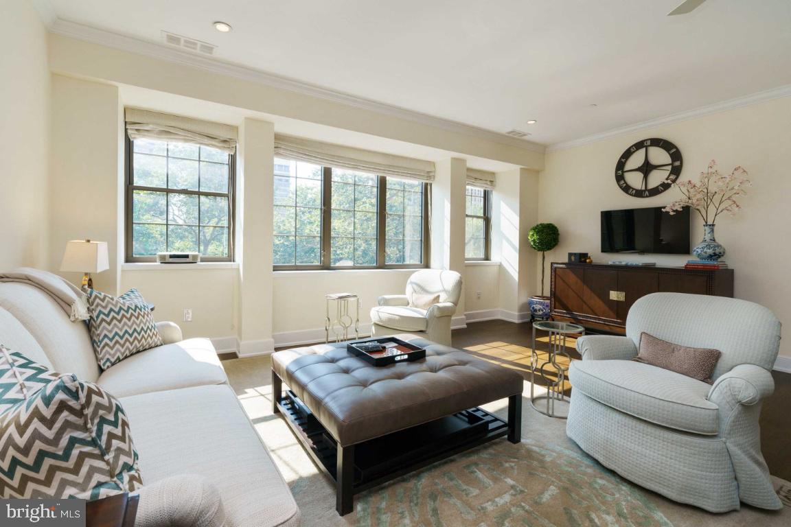 One-of-a-kind two bedroom, two and a half bathroom designer residence overlooking Rittenhouse Square. Constructed with custom finishes and appointments throughout, Parc Rittenhouse #507 offers hardwood floors, spacious bedroom suites and large windows showcasing panoramic Rittenhouse Square and city skyline views. There is a chef's kitchen with Downsview cabinetry, quartz countertops, breakfast bar and stainless steel appliances, including a Sub-Zero refrigerator and freezer, Wolf cooktop and wall oven, industrial grade hood and microwave. There are two bedroom suites with his-and-hers walk-in closets one bathroom has a double vanity, glass enclosed shower, tub and private commode, the other has a double vanity and glass enclosed shower and views of Rittenhouse Square. Additional home highlights include a powder room with a hidden side-by-side Asko washer and dryer and incredible natural light throughout. Residents of Parc Rittenhouse enjoy a 24-hour doorman, state-of-the-art fitness center, clubroom and boardroom and a rooftop club featuring an outdoor pool, whirlpool spa, kiddy pool and sundeck with lounge chairs. Rittenhouse Square is ranked the 6th best neighborhood in North America by Places Rated Almanac. There are 175 restaurants and 199 retailers within a three block radius. Within close walking distance to the Market Street office corridor, The Avenue of the Arts and University City. 30th Street Station and Philadelphia International Airport are only minutes away.
