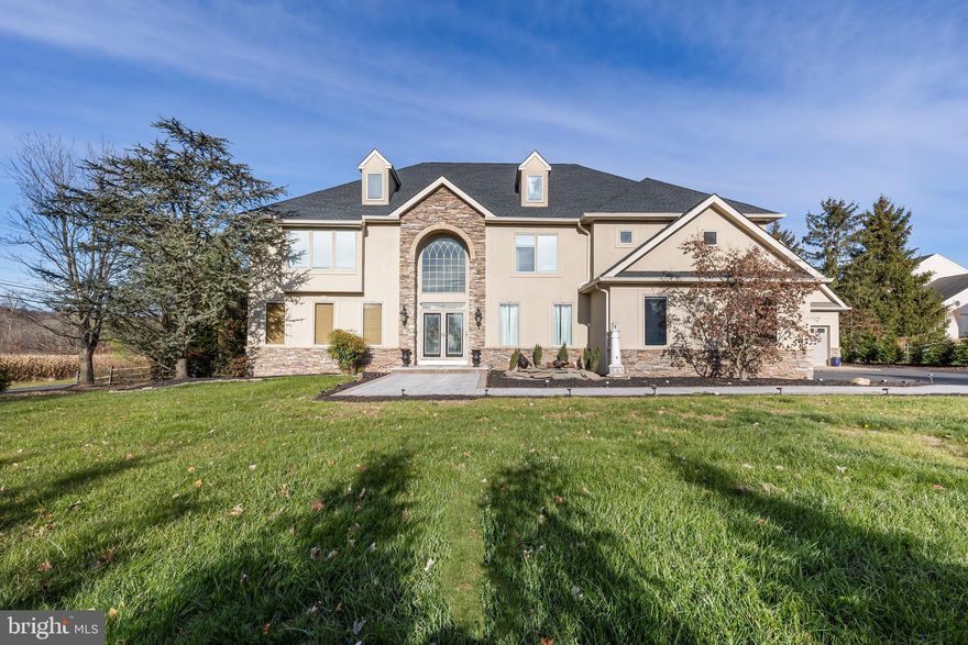 Welcome to Excellence at Seven Corners Rd. This exceptional  5 bedroom, 4 full and two half bath home is situated on 1.1 acres and offers so many features for your lifestyle. Walk down the new paver walkway or enter through the 3-car garage and you’ll enjoy every feature this rare custom home with tons of updates has to offer. Recently refinished hardwood floors on main and 2nd floor, recessed lighting, custom and modern millwork, built-ins, contemporary lighting and Z-wave technology for all the lighting for full automation. The Luxury kitchen boasts all custom cabinetry, pull out and many convenient options. High end, Dacor appliances, pot faucet, professional vent, pantry, large island and under cabinet lighting. The great room is gorgeous and inviting for large gatherings or cozy for low-key relaxing around the gas fireplace. Be sure to check out the 360 tour of this home for all of its offerings. A desirable main floor bedroom with full bath, open dining area as well a main floor laundry will make life simple and easy.  Upstairs more luxury and an oasis awaits. Modern main bedroom with open floor plan and lots of light. Relax in the sitting area with fireplace and feel connected to you loved ones. A Jack & Jill bathroom as well as a princess suite offers adds to the features you’ll appreciate on the 2nd floor.  2nd floor also adds a 2nd laundry room.  The lower level access is behind a build in bookcase and features walk-up stairs to the exterior and fantastic lifestyle features including: A home gym area, a home theatre with Sony sound system, auto keystone projection and fiber optic starlights. The main area offers a lounge area, large play room and is great for extended family or large gatherings. A bonus room currently used as a guest bedroom offers flexibility for an office/hobby room and more. Both garages are heated. The attached garage offers electric vehicle charging. The detached garage also contains a pool-house/clubhouse with living space, full bath, kitchenette, loft and is also heated. Relax by the newly plastered heated pool with all new components, remote Inteli-center and prepped for salt. Plenty space for parking and storage on the property, large private outdoor living space and yard. The back patio offers an outdoor kitchen, shaded coverage and a great place for parties!  With several hundred thousand dollars of upgrades and updates you’ll want to come see this home soon. Home is in desirable Pennridge school district.