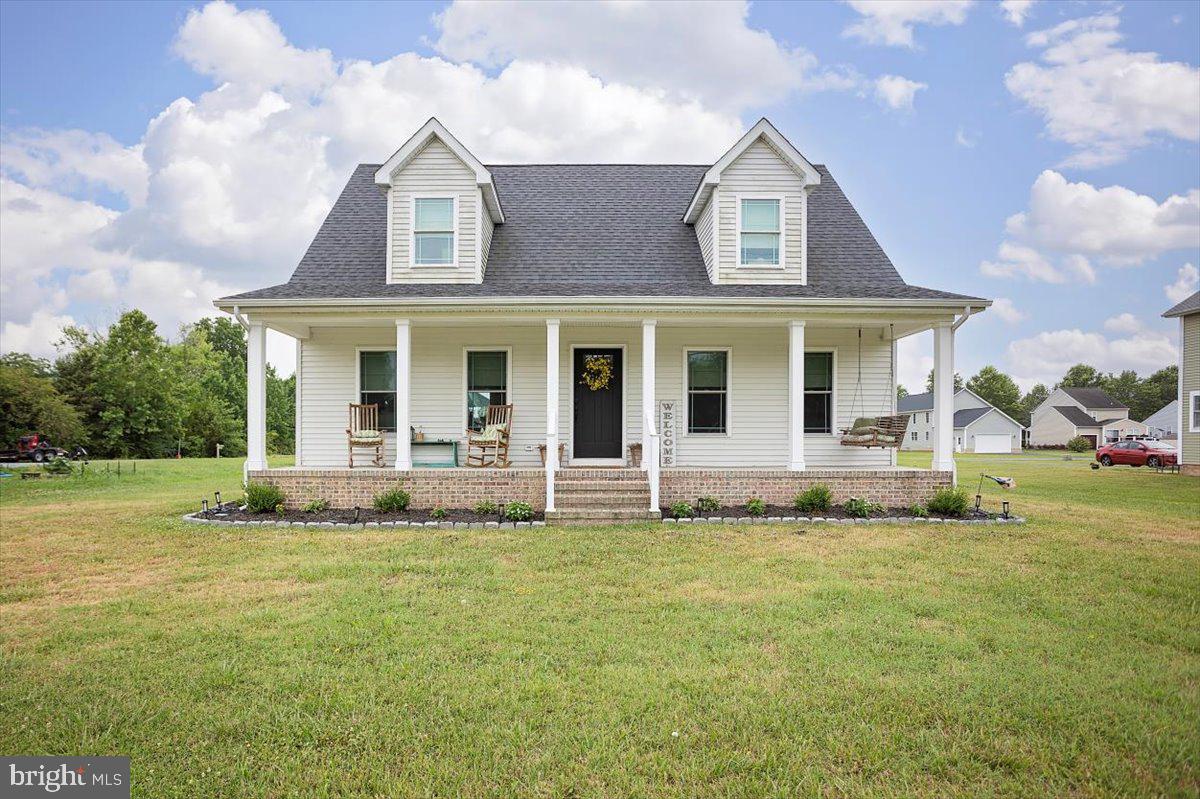 Welcome to this charming Cape Cod nestled in the heart of East New Market, built in 2021 and brimming with character. This 4-bedroom, 2.5-bath home offers the perfect layout with a spacious primary suite on the main level and three additional bedrooms upstairs. The inviting front porch is straight out of a storybook—perfect for relaxing evenings or morning coffee. Inside, you'll find a modern, open floor plan with tasteful finishes and plenty of natural light. With all the comfort of newer construction and the charm of classic design, this home is the perfect blend of cozy and contemporary.