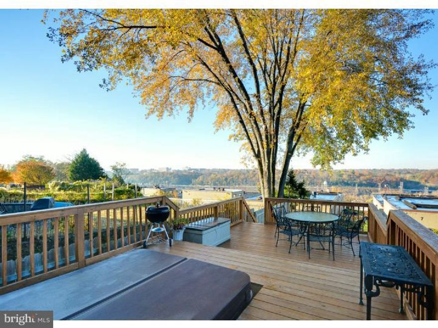 Beautiful townhouse in desirable Manayunk borough of Philadelphia, completely remodeled this year. This home features 3 bedrooms, 2 full bathrooms, and a brand-new walk-out deck with built in 8-person hot-tub. Enjoy the beautiful panoramic views of the river from the hilltop perch and privacy the grown-in backyard provides. Inside you will find an open living space connecting living room, dining room and kitchen perfect for entertaining. The brand-new kitchen features granite counters, stylish tile backsplash and stainless steel appliances. The red pine hardwood floors have been refinished throughout the house and all the rooms have been freshly painted in modern neutral tones. This energy efficient home features brand new windows and a central air and heating system. The bedrooms have large closets, and the clean and dry basement provides additional storage space. Easy street parking and close walking distance to Manayunk's thriving downtown, with shopping, dining, public transportation, and highway access. This house has it all!
