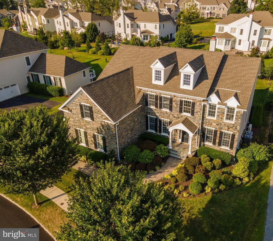 Welcome to this stunning home in the highly desirable, award-winning 50 acre community of Liseter. This gorgeous home is situated on a flat lot in a premium location in the development, with privacy and idyllic views of open space and professional landscaping. Guests and family are welcomed into the gracious 2-story foyer and immediately appreciate the exceptional warmth and character found throughout the home. Large windows fill the house with light while beautiful hickory hardwood floors and custom millwork provide architectural details and subtle elegance. The formal sitting room looks out onto open space and the spacious dining room is perfect for intimate dinners or large gatherings. The upgraded Palladian gourmet kitchen is bathed in light and features abundant cabinets, a large island with quartz countertop and seating, under cabinet lighting and an expansive walk-in pantry. The breakfast room enjoys a beautiful view of the landscaped backyard and opens to a fabulous, 2-tier stone patio. The built-in grill and refrigerator are great for outdoor entertaining and during cooler months, the gas fire pit is the perfect place to unwind at the end of the day. The spacious family room features large windows, a gas fireplace with stunning 2-story stone surround, built-in shelving, and sliding barn doors housing the TV mount. The bright, handsome study has built-in shelving and cabinetry and is perfect for those work-at-home days. A powder room and large laundry room are also found on the first floor. The second floor hall looks out onto the first floor, enhancing the open, spacious feel of the home. The gracious owners suite is bathed in light and boasts a sitting room with built-in cabinets and shelving, 3 custom walk-in closets, a dressing area, and a sumptuous bath with dual vanities and soaking tub. Two generously sized guest bedrooms share a hall bath and a third guest bedroom has an en-suite bath. The exceptional finished basement in this home has something for everyone, including a full kitchen/bar with custom cabinets, quartz countertops, island seating, dishwasher, convection oven/microwave, commercial back bar refrigerator, clear ice machine, wine storage and an architectural ceiling. The basement also features a full bath and 5th bedroom, a sitting area for enjoying the big game on the 10 foot projection TV, a dining alcove, and a home gym. You’ll never want to leave! Meticulously maintained, there is nothing to do except unpack your bags and enjoy all that Liseter has to offer – a beautiful club house, infinity swimming pool, tennis courts, and walking trails. Don’t miss the opportunity to make this exceptional home your own!