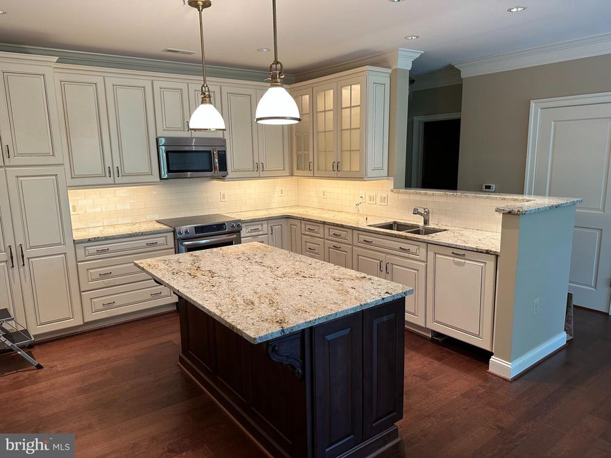 ABSOLUTELY BEAUTIFUL, Renovated in 2015 to Include a Special Lighting System, All Wood Floors, Gorgeous Primary Bathroom, Fabulous Kitchen, Deluxe Bathroom 2, Custom Window Treatments, Custom Built ins in Bedroom 2,  1 Assigned Parking Space in the Covered Garage and a Storage Locker.