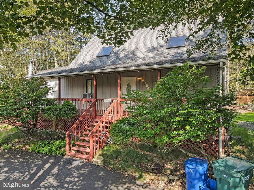 LOCATION!! LOCATION!! STEPS TO LAKE CAROBETH ACROSS THE STREET AND COMMUNITY BEACH ACCESS!!! SEASONAL LAKE VIEWS! 3 Bedroom 2.5 Bath with WOOD STOVE in the SPACIOUS 16.5 X16 Family Room! PRIMARY BEDROOM ENSUITE ON THE FIRST FLOOR! LAUNDRY also on the FIRST FLOOR! Wrap-around Deck and Covered Front Porch for those Warm Rainy Summer Days! Multiple Sliding Doors allowing an abundance of natural light and multiple access points to the deck! This is your next vacation Lake House or Short Term Rental Investment! Close to Pocono Attractions and Shopping! Convenient to highways and under 2 hrs to NYC! LOW TAXES! PUBLIC WATER & SEWER!! Community Amenities Include: Security; Gated; Barbecue; Clubhouse; Party Room; Picnic Area; Teen Center; Day Camp; Playground; Street Lights; Park; Recreation Room; Outdoor Pool; Children's Pool; Trail(s); Tennis Court(s); Pickleball; Basketball Court; Shuffleboard Court; Sport Court and Dog Park!! WOW! Schedule your Showing today!!