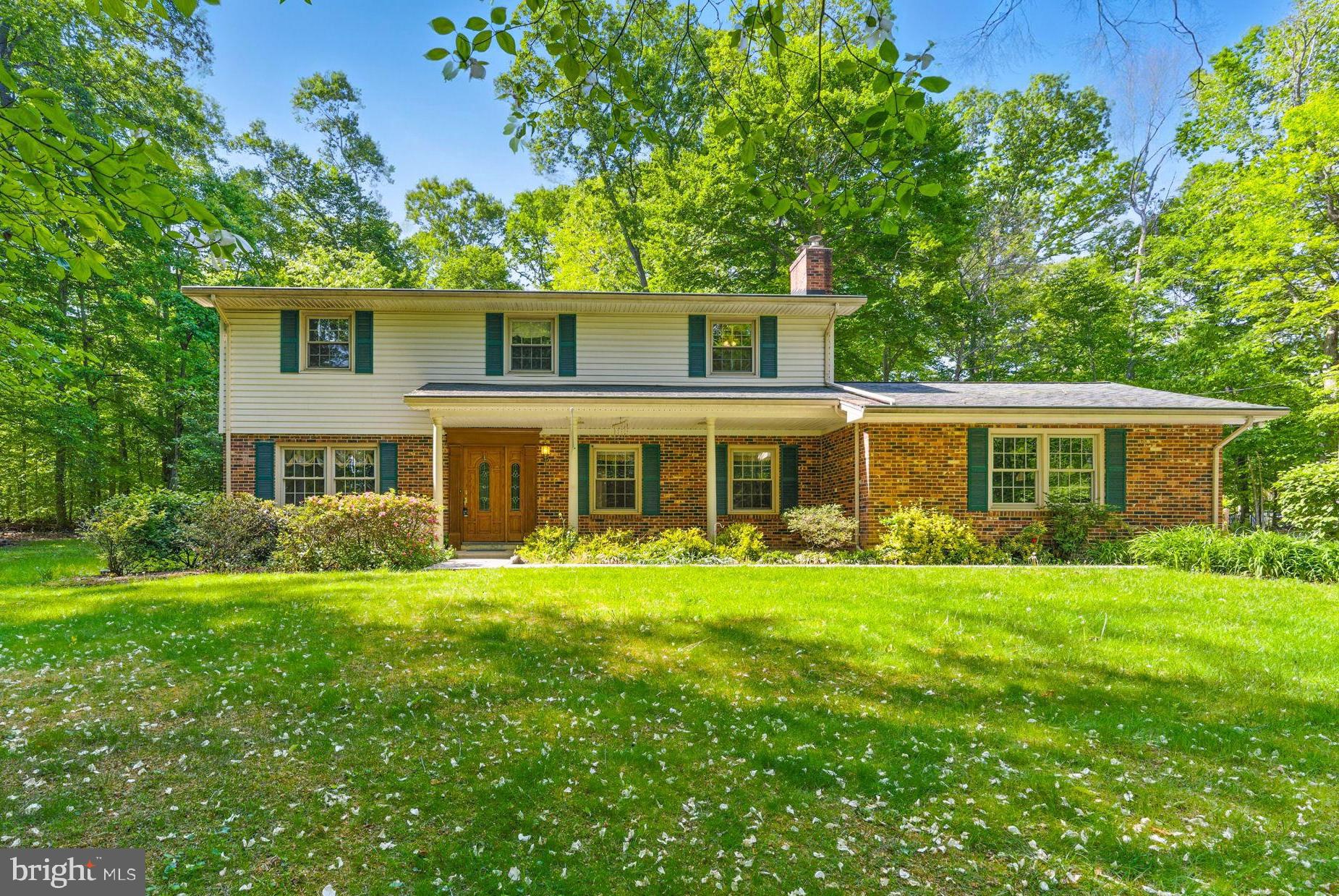 Extensively updated and beautifully maintained, this Colonial offers modern comfort and timeless charm in a private, end-of-street setting. Recent updates include freshly painted interior, hardwood floors (just 3 years old), updated double-pane thermal windows, updated HVAC system with electronic air filter, and a waterproofed basement with dual sump pumps and battery backup. Both full bathrooms have been renovated with raised vanities, granite countertops, tile flooring, and upgraded fixtures. The kitchen has also been updated with Corian counters, high-end cabinetry, stainless steel appliances, and ample recessed lighting. The main level features an inviting open layout with hardwood floors throughout. The foyer leads to hardwood stairs with white risers, and the spacious living and dining rooms are enhanced by crown molding and natural light. The family room offers a full-wall brick fireplace with hearth, recessed lighting, and direct access to the kitchen and breakfast area. The breakfast nook includes custom faux painting, bay window, crown molding, chair rail, and a ceiling fan, plus access to a large brick paver patio and composite deck with built-in bench seating. A side door and brick walkway lead to the large gravel driveway and backyard. Upstairs, the owner’s suite includes a renovated en suite bath (2013), linen closet, and spacious layout. 3 additional bedrooms each offer ceiling fans, and one includes a charming built-in daybed with storage. The wide upstairs hallway makes moving furniture easy.
Full basement is ready to be finished to your liking. The oversized two-car garage features workbenches (convey), automatic opener, and is hardwired for a generator. Ductwork was professionally cleaned in 2018/2019. Additional features include a brick front with vinyl siding, helmet-style gutter guards, freshly painted shutters and back door, floodlights, and built-in speakers inside and outside. With a covered front porch, landscaped yard, and ample parking, this home is truly move-in ready in a peaceful private setting.