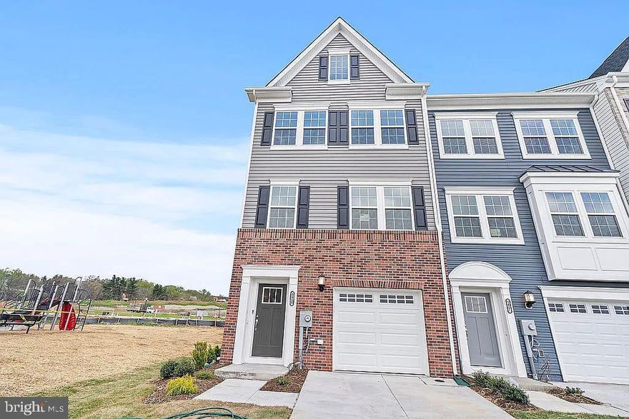 Welcome to this beautiful 3-level end-unit townhome, built in 2022 and located in the desirable Sycamore Ridge community in Frederick. This modern home offers 3 bedrooms, 2 full and 2 half bathrooms, and a 1-car garage. The entry-level features a spacious recreation room with a half bath, perfect for a home office or flex space. Hardwood floors run throughout the main level, where you'll find an open-concept layout ideal for both relaxing and entertaining.

The gourmet kitchen is a chef’s dream, featuring 42” cabinets, recessed lighting, a gas range, built-in microwave, and a large island with seating for four. The kitchen flows seamlessly into the dining area and sunlit living room, which opens to a Trex deck through French doors—perfect for enjoying outdoor space. Upstairs, the primary suite includes a walk-in closet and a luxurious ensuite bath with a double vanity and frameless shower. Two additional bedrooms share a full bath, offering plenty of room for family or guests.

This home is just minutes from Historic Downtown Frederick, Fort Detrick, Frederick Research Park, and NCI, with quick access to Route 355, I-270, and I-70. Enjoy nearby shopping at Market Square, Wegmans, and Walmart Supercenter, as well as community amenities like tot lots, trails, and scenic mountain views. Whether you're working from home or exploring everything Frederick has to offer, this home is the perfect blend of comfort and convenience.!