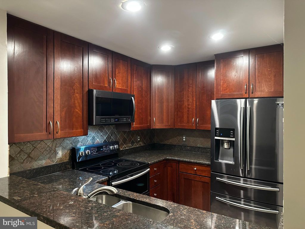 Photo of 7802 Harrowgate Circle #C, SPRINGFIELD, VA 22152 (MLS # VAFX2277414)