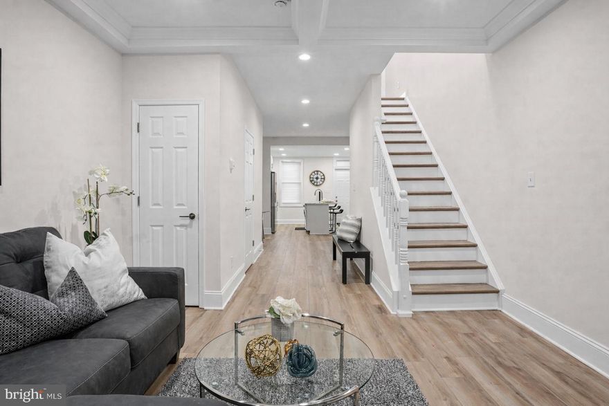 Newly renovated and move-in ready 3BR/2.5BA Townhome. Make your way to the covered front porch and step into your stunning new home. This home features numerous upgrades, including luxury flooring, recessed lighting, wide base moldings, and a custom tray ceiling.  The main floor features the open floor plan homeowners crave, boasting a large living room with a stunning tray ceiling, an open dining area, a half bath, and gorgeous kitchen.  The kitchen features ample cabinets, sleek quartz countertops, stainless steel appliances, and a deep stainless sink set into an island with breakfast seating. On the second floor, you will find two sizable secondary bedrooms, one featuring a skylight, a newly renovated and beautifully tiled full bath, and a primary suite.  The primary bedroom is spacious offering a private full bath with a luxuriously tiled walk-in shower.  The lower level is finished offering additional living space that features a recreation room, storage, laundry, and a walk-out to the privately fenced yard.  From the kitchen step out onto a newly constructed oversized wood deck that leads to the newly fenced yard. The yard features a large patio/parking pad and offers so many possibilities.  This move-in-ready home offers new homeowners so much and is located near shopping, restaurants, and commuter routes.