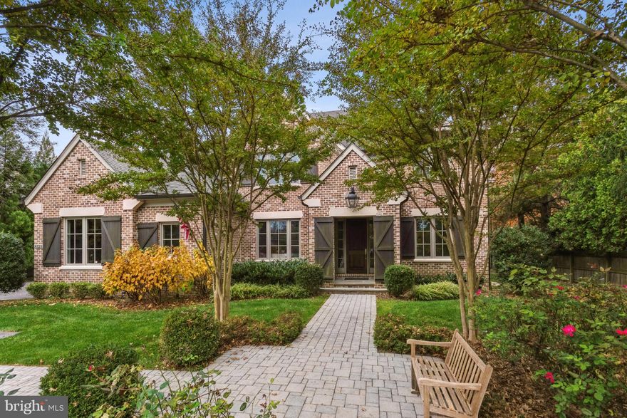 Welcome to this gracious all-brick custom residence by Artisan Builders, offering classic design and modern functionality in a premier McLean location. Set on a beautifully landscaped, flat backyard, the property provides endless opportunities for outdoor living, ideal for entertaining, gardening, or simply relaxing in a serene setting. From the moment you enter the Foyer, you'll notice the attention to detail that defines this home. Elegant millwork, gleaming hardwood floors, and light-filled spaces create a warm and sophisticated atmosphere. The formal Living Room and Dining Room with a Butler’s Pantry make hosting seamless. The main-level Office is both stylish and practical, featuring custom built-ins, large windows, and French doors for privacy. The Family Room, with its beamed ceilings and striking stone fireplace, flows into the Kitchen which is the heart of the home. The Kitchen boasts a large center island, custom cabinetry, walk-in pantry, and charming Breakfast Room with easy access to the patio and backyard. A thoughtfully designed Mud Room is equipped with cubbies, shelving, a work desk, and a half bath. Upstairs, the luxurious Owner’s Suite offers vaulted ceilings, dual walk-in closets, and a spa-like bath with separate vanities, soaking tub, and glass-enclosed shower. Three additional en-suite Bedrooms and a Laundry Room complete the upper level. The finished Lower Level features a large Rec Room with fireplace and Wet Bar, a fully equipped Fitness Room with Sauna, and a private Guest Suite with Bedroom and full Bath. Generous storage throughout adds to the home’s practicality. Located in a sought-after neighborhood just moments from The Potomac School, Langley Fork Park, and Clemyjontri Playground, with easy access to downtown McLean and the George Washington Parkway—this is a timeless home in an unbeatable location.