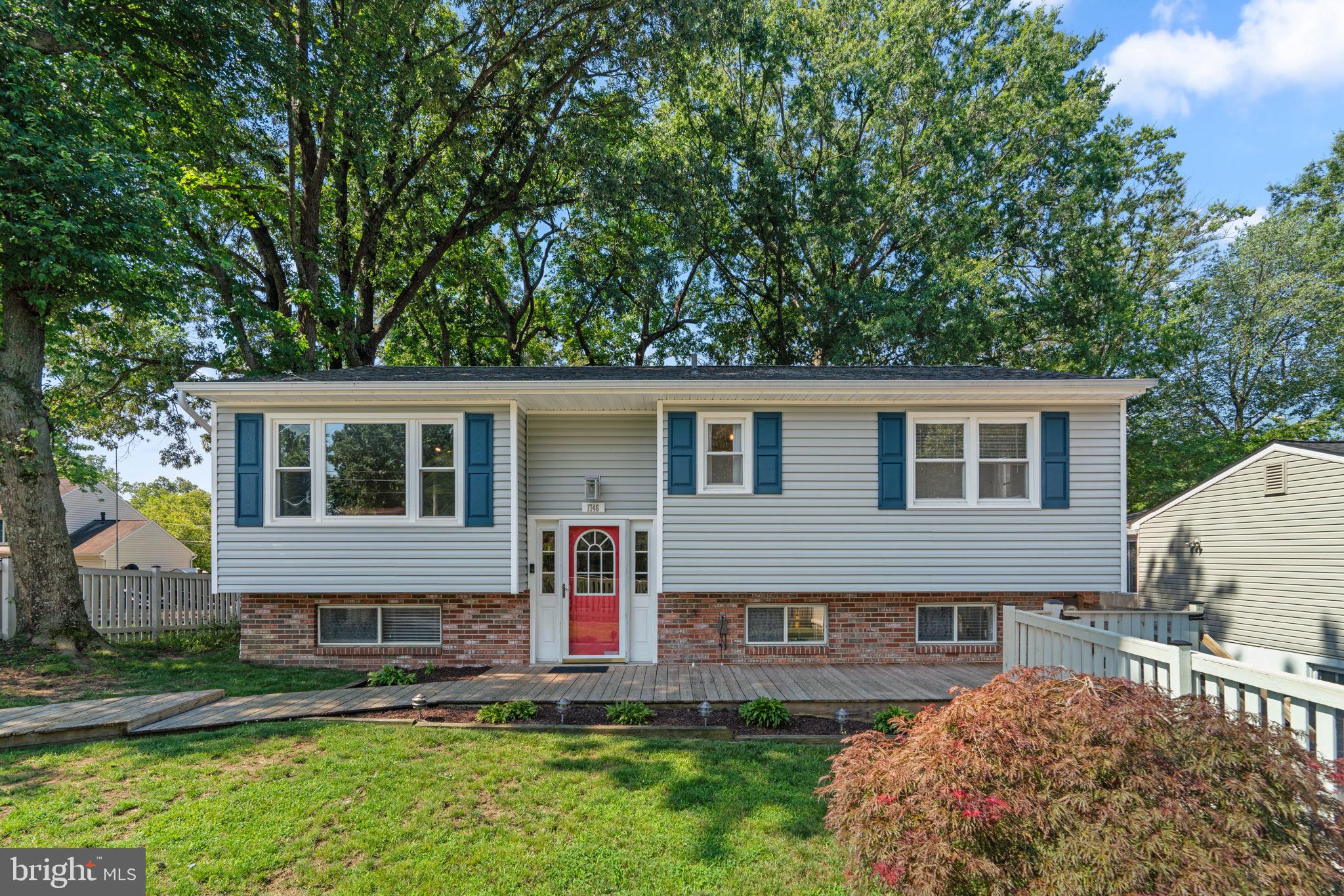 Open House: Saturday, July 26, 11:00AM - 1:00PM. Welcome to Woodland Beach — a vibrant water-privileged community offering beaches, boat launches, playgrounds, and more! This spacious 4-bedroom, 2.5-bath split foyer sits on three lots and features a large detached garage perfect for storage, hobbies, or extra parking. Inside, you'll find an updated kitchen with an eat-in area and direct access to a deck, ideal for outdoor dining and entertaining. The expansive lower-level family room provides flexible living space, and the layout includes two private bedroom suites, one on each level, each with its own bathroom (main level bedroom suite is half bath) — perfect for guests or multi-generational living. The fenced front yard offers both privacy and curb appeal. Don’t miss your chance to live in one of Edgewater’s most amenity-rich neighborhoods!