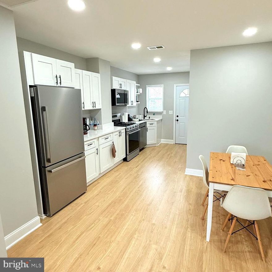 This stunning, fully renovated townhouse has been thoughtfully designed to provide both style and comfort. It offers an open concept main level that flows into the living room, dining and kitchen space with a great storage space that could work as a pantry. This townhouse offers 2 bedrooms and 2 bathrooms with a fully terminated basement. New AC unit, Water heater, roof, and appliances, new and comfortable porch. Updated Luxury bathrooms with brand NEW vanities, tiles, faucets, light fixtures and shower systems, and a skylight. Located in Brooklyn Park neighborhood, in a very quiet street. This home is close to Garret Park Maryland and the Enoch Pratt library. Sellers put a lot of design and efforts to make this the perfect house for you and your family.