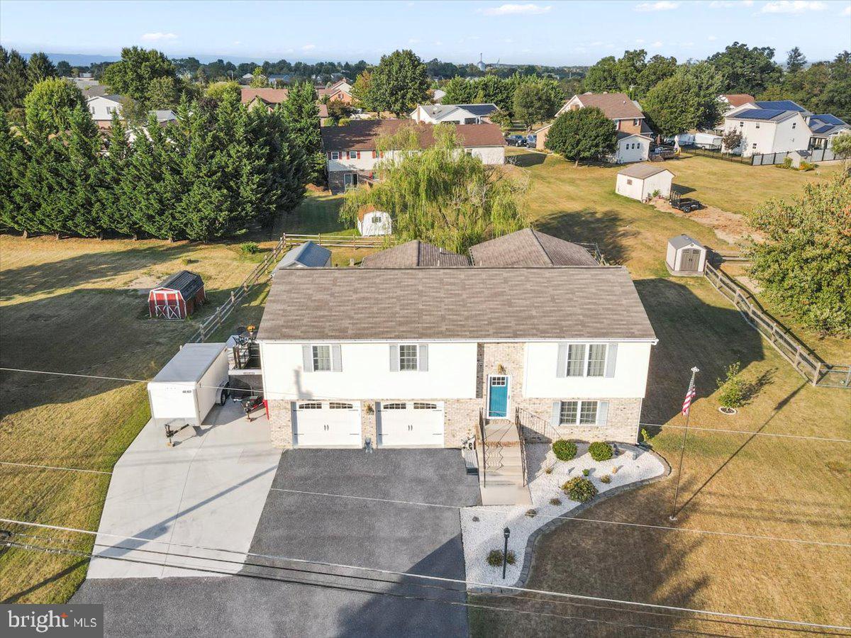 Welcome to 918 Sollenberger Road in the heart of Hamilton Township, Chambersburg, PA! This immaculate three-bedroom, two-and-a-half-bath split-level home is the epitome of turn-key living. Nestled in a peaceful neighborhood, this property offers a perfect blend of comfort, style, and convenience. From the moment you step inside, you’ll notice the meticulous care and attention to detail that has gone into maintaining this home.
Don’t let this home deceive you — it boasts two substantial additions at the rear, significantly increasing the living space. One addition measures 15 by 18 feet and spans both the upper and lower levels, adding approximately 520 square feet. The second addition is 15 by 8 feet, contributing another 120 square feet — for a combined total of 640 square feet of additional living space. These spacious extensions enhance both functionality and comfort, making the home feel even larger than it appears.
The living areas are bright and airy, with plenty of natural light that flows effortlessly through every room. The updated kitchen features modern appliances and ample counter space, making meal prep a breeze. The master suite offers a private retreat with its own en-suite bath, while the additional two bedrooms are generously sized and perfect for family or guests. The lower level includes a cozy family room and an additional half bath, ideal for entertaining or relaxing.
With new flooring, fresh paint, and updated fixtures throughout, this home is move-in ready and requires no work on your part. The large backyard provides plenty of space for outdoor enjoyment, whether you're hosting a BBQ or just enjoying the tranquil surroundings. Located in Hamilton Township, you’ll have easy access to local amenities, schools, and major roadways, making this home an ideal choice for anyone looking to live in a welcoming community with a perfect balance of privacy and convenience.
Don’t miss the chance to call this turn-key beauty your new home — just move in and enjoy!