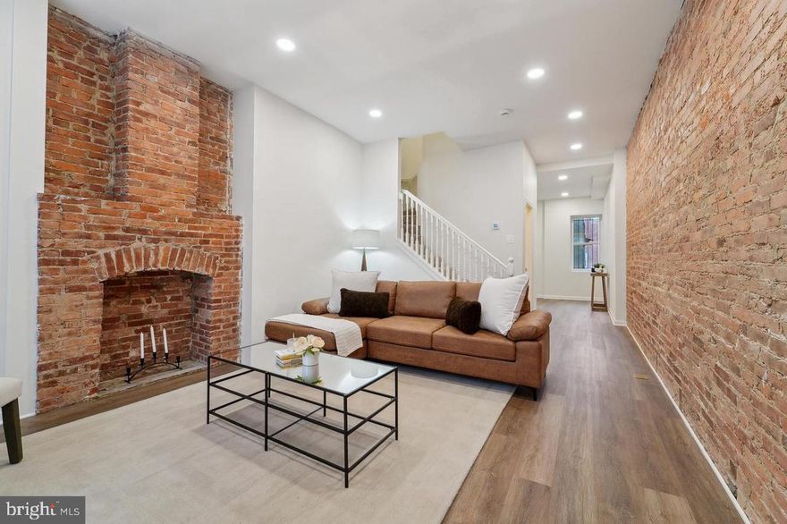 Spacious and fully updated 3-bedroom, 2.5 baths rowhome with an urban- contemporary flair! Just what you’ve been searching for.  This beauty features a sunlit, open-floor plan that illuminates the exposed brick wall and fireplace accent.    A “good to be home” feeling with a sense of community and family is what you will find here.  This rare rental is ready for family and friends’ gatherings on the main level with a half-bath, livingroom, dining area, spacious kitchen with granite counter tops and stainless-steel appliances.  The home also features luxury vinyl plank flooring on the main level and cozy carpet on the upper level.  You will find 3 spacious bedrooms on the upper level, all with more than ample closet space, as well as your washer and dryer.  Need more space for storage?  The unfinished basement is able to meet your storage needs.  Set the stage for a show-stopping Baltimore City lifestyle! The superb market location brims steps away from shopping, dining, and doing!  Easy access to public transportation, 83, Johns Hopkins University and University of Baltimore.   VOUCHERS WELCOME.  Schedule your tour today!