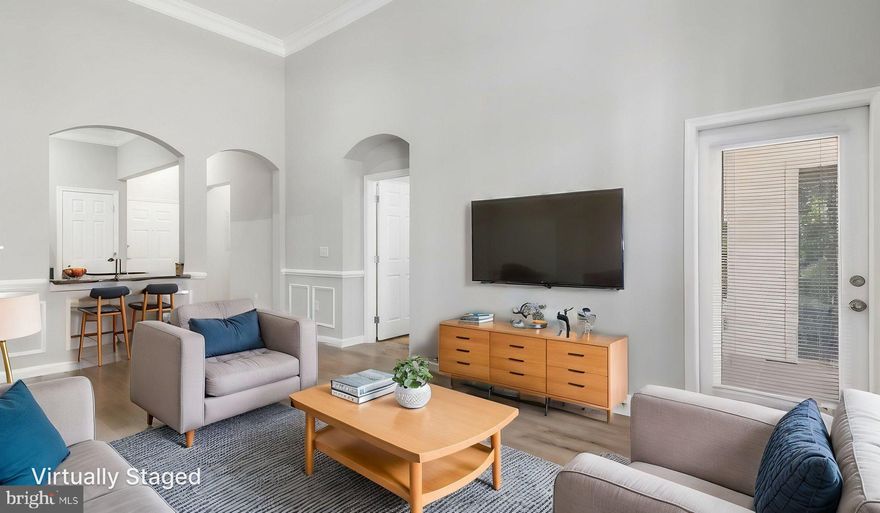 Welcome to this stunning one-bedroom, first-floor condominium with soaring ceilings in the sought-after Colonnade at Kentlands community! This beautifully designed unique unit features stainless steel appliances, granite countertops, gas fireplace, in-unit washer & dryer, new bathroom countertop, sink & vanity, and lovely flooring. The bedroom is generously sized with a large walk-in closet and adjacent full bathroom.  Unlike many other units, THE SALE PRICE INCLUDES A LARGE STORAGE UNIT (S-23) in the same hallway.  And, the unit includes a separately deeded, super close, assigned parking space (#11) in the covered, gated garage.  Enjoy all the amenities this community has to offer, including a two-story fitness center, gorgeous swimming pool, sauna, meeting room, pub room,  & library.  Exceptionally convenient location, with wonderful shops, dining, and entertainment options right nearby in the Kentlands neighborhood. This condo is the perfect place to call home.  Don't miss out on this amazing opportunity!