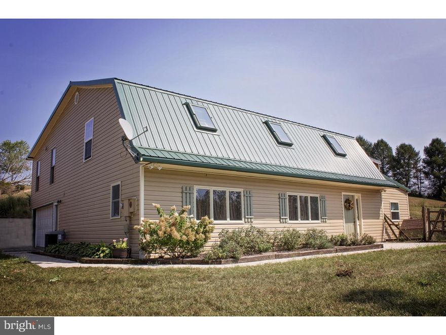 COUNTRY LIVING - Almost 4000 Sq Ft 4 bedroom, 2 full luxurious bath home on 1 acre corner country lot. Completely renovated top to bottom.  Featuring a HUGE 49'x29' Great Room/Dining Room with hardwood floors. Lots of windows for natural light. Open floor plan with Large Country Kitchen featuring ceramic tile floors, island with counter bar. Great  home for large family gatherings, Newly renovated full bath and  private office. also 3 very spacious bedrooms plus a large master with huge walk-in closet. Top it off with a very large 2nd bath featuring radiant floor heat ceramic tile fl.shower with glass door, Jacuzzi jetted tub and large double vanity with vessel sinks. Attached 2 car garage with 16' x 7' door with opener. Also the home boasts a state of the art wood fired external boiler for efficient hot air heat and hot water. Electric hot water heater for summer months.  Central A/C. Fenced in dog run accessible for the dogs through a doggy door. This is a MUST SEE home. Close to Cabelas and Rt 78 in Tilden Twp.