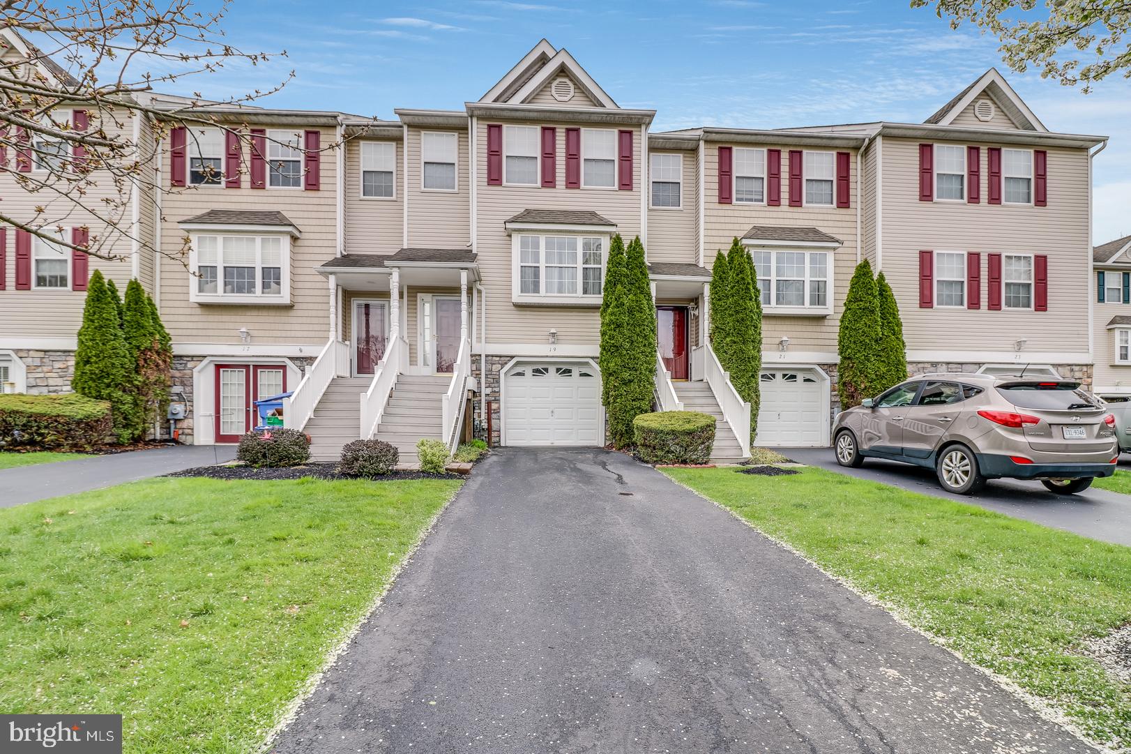 What a lovely 3 bedroom, 2.5 bath townhome located in the desirable community of Trotters Run. As you enter the home you'll immediately notice the open floor plan and bamboo hardwood flooring throughout the first level. The recessed lighting, neutral color tones and large windows makes this home bright and welcoming. The living room features an elegant fireplace that is surrounded by natural stone from floor to ceiling. As you walk pass the spacious dining area, you'll be amazed by the open kitchen with shaker cabinets, quarts counter tops, stainless steel appliances and farm sink. The breakfast bar adds a nice touch and is perfect for grabbing a quick bite to eat or socializing with family and friends. Just off of the kitchen, through the sliding doors is a large extended deck which is ideal for gatherings or simply relaxing on a nice sunny day. Upstairs, you'll find a spacious main bedroom with a large walk-in closet and full bathroom. The two additional bedrooms are also generously sized. Looking for additional space? The spacious finished basement provides plenty of room for entertaining. Be sure to put this one on your list to tour and you won't be disappointed!