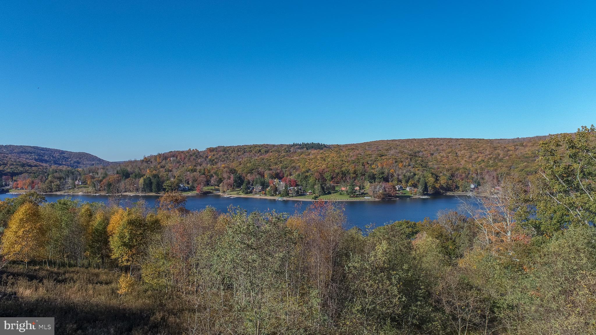 Enjoy the best the lake has to offer from 'Overlook Ridge'! Boasting year-round lake views, yet tucked away in a peaceful and serene community setting. Short drive to the community lake access area for swimming and fishing! Dock Slips may be leased through HOA. Utilities to site and ready to build your perfect four-season Deep Creek getaway. Located just off of Rt. 219, with easy access to all area amenities, including local establishments, state parks, and Wisp Resort. Don’t miss your chance to buy and build your dream home right in the heart of Deep Creek Lake. Call today for details!