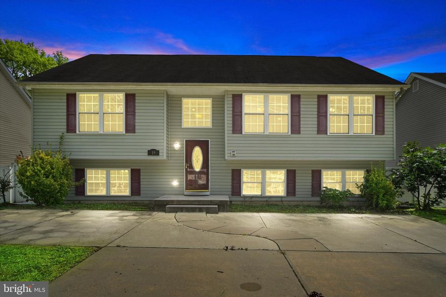 Beautifully maintained 5BR/3BA split foyer Ranch located in the quiet neighborhood of Middle River. An adorable white picket fence surrounds the front yard and double wide driveway that takes you to the entry of your forever home. The split foyer beams with natural light from a large window above the door, and offers views of the main floor and lower level.  Notice the details of crown and picture frame moldings throughout the home, and the beautiful hardwood flooring.  The main living space boasts a vaulted ceiling in the living room, dining room, and kitchen. The gorgeous kitchen features wood cabinets finished with crown molding, a separate pantry closet, granite countertops with a complimenting backsplash, stainless steel appliances, and an island with room for seating on both sides.  The spacious dining room is ideal when hosting family and friends. Down the hall are two sizable secondary bedrooms, a full bath, and a primary bedroom suite.  The primary boasts a vaulted ceiling with crown moldings, a large walk-in closet, and private ensuite featuring a large soaking tub. The lower level is finished with easy care flooring, above grade windows, two additional bedrooms, a full bath, a grand family room, laundry, storage, and a walk out to the fenced yard. From the dining room step out onto a spacious deck that overlooks the abundance of green space and forest like surroundings. The land beyond the fence is secure from ever being built on. This home is move-in ready and has so much to offer new homeowners including, a freshly painted interior, recessed lighting and much more.  Imagine all this and in close proximity to shopping, restaurants, and commuter routes.