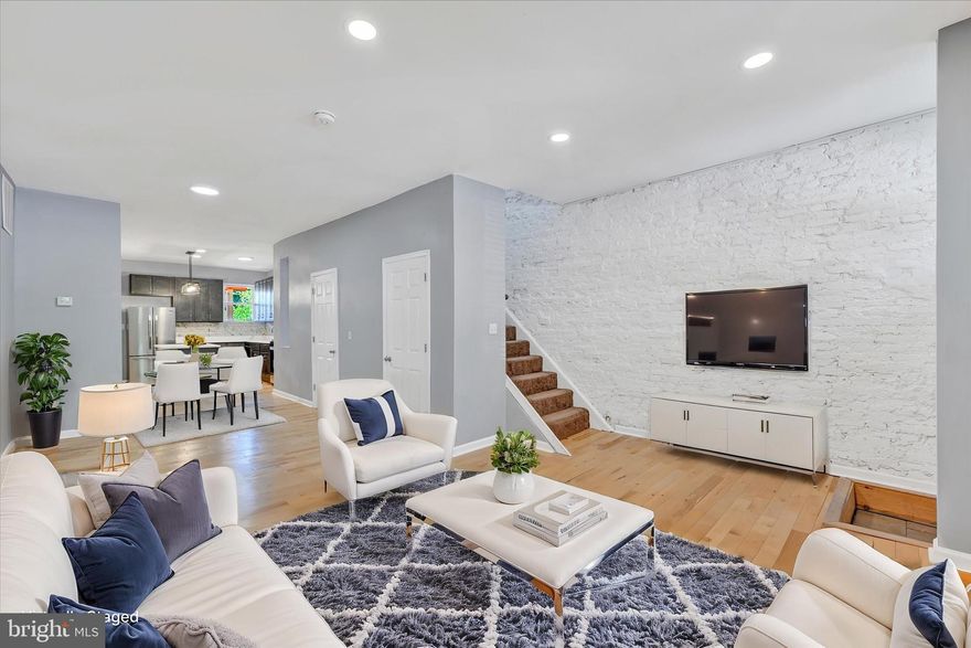 Welcome to 327 E 24th Street — a beautifully updated, move-in ready townhouse in the heart of Charles Village! This 3 bedroom, 2.5 bathroom home is full of charm and modern upgrades, including hardwood floors, recessed lighting, and stylish finishes throughout.
The main level features a spacious living room with an exposed brick accent wall, a dining area, and a stunning kitchen equipped with stainless steel appliances, quartz countertops, a center island, and a sleek backsplash. A convenient half bathroom completes this level.
Upstairs, you'll find three comfortable bedrooms, including a spacious primary suite with a private bathroom and generous closet space. An additional full bathroom is located in the hallway.
The basement offers a laundry area and plenty of storage space, with potential for future customization. Step out back to a private rear deck — perfect for relaxing or entertaining.
Ideally located near dining, shopping, and major commuter routes, this home has everything you need. Schedule your showing today!