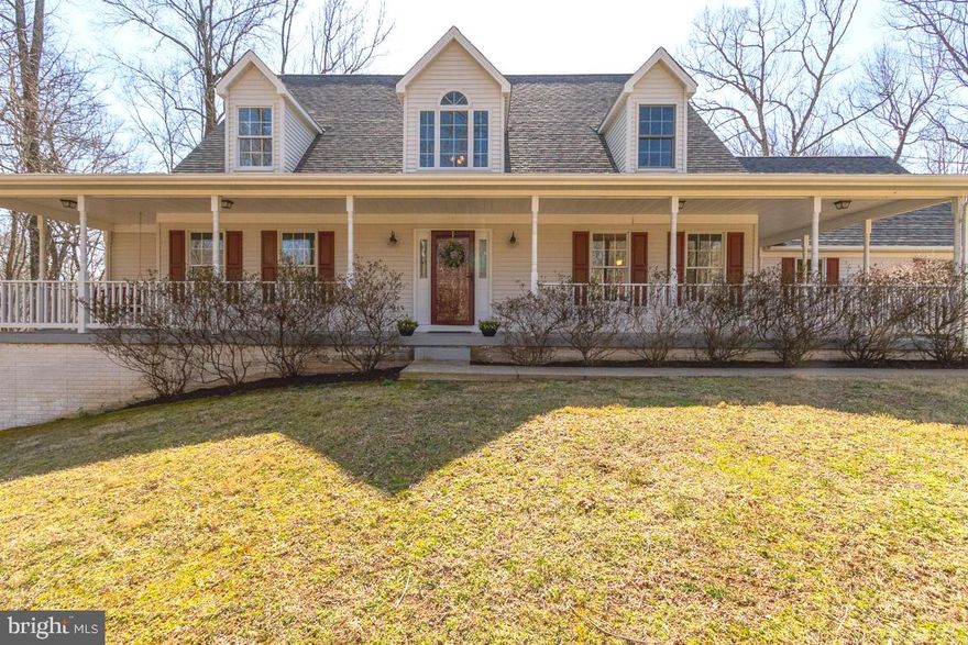 Stunning home in Wildwood Forest!  Wow! This wonderful home has so many great features!  Comcast high-speed internet!!!  No HOA! 4 bedrooms, 3.5 bathrooms, two-story family room with stone fireplace overlooks the 2+ acre property backing to Indian Run stream.  Fantastic screened-in porch off the family room to enjoy morning coffee and peaceful sounds of nature.    MAIN LEVEL PRIMARY BEDROOM is spacious and has a wonderful en-suite jetted soak tub and separate shower.   Beautiful gourmet kitchen with granite countertops, stainless appliances including a beverage/wine frig, large kitchen island  and a huge walk-in pantry is open to the  breakfast room for fun family gatherings.  There is also a formal dining room and additional bedroom on this level  plus main level laundry and a spacious garage.  Upstairs features two large bedrooms with fresh paint and new carpeting.  There is a nice full bathroom on this level and the open hall overlooks the family room and rear yard,  one of the nicest in the development!  The lower level has a huge recreation room with sliding glass doors.  There is also a convenient half bathroom on this level and two large storage rooms.   You will love the wrap around front porch, fully fenced rear yard, large driveway with lots of parking and a beautiful stone sidewall.  There is  lots of fresh paint and new carpeting on the main and upper levels,  gleaming hardwood floors on the main level,  wonderful views and peaceful respite of this wonderful property is like a vacation at home!  Make your appointment today! Check out our walk through Matterport tour: https://my.matterport.com/show/?m=t6BAHEvBZG7