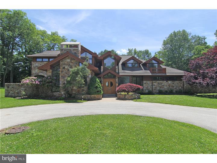 Expect the unexpected. This is a true modern day castle. The first impression is huge open entertaining space yet the home gives the residents a warm comfortable feeling. Custom built with quality craftmanship and numberous architectural details that will delight. Rich wood built in furniture, arched windows and stone walls make an exquisite dining room. The exterior stone walls make the inside sound proof to exterior noise yet the large windows fill the house with light and the home offers bocolic views of surrounding landscape. Must see in person to admire this quality and value.