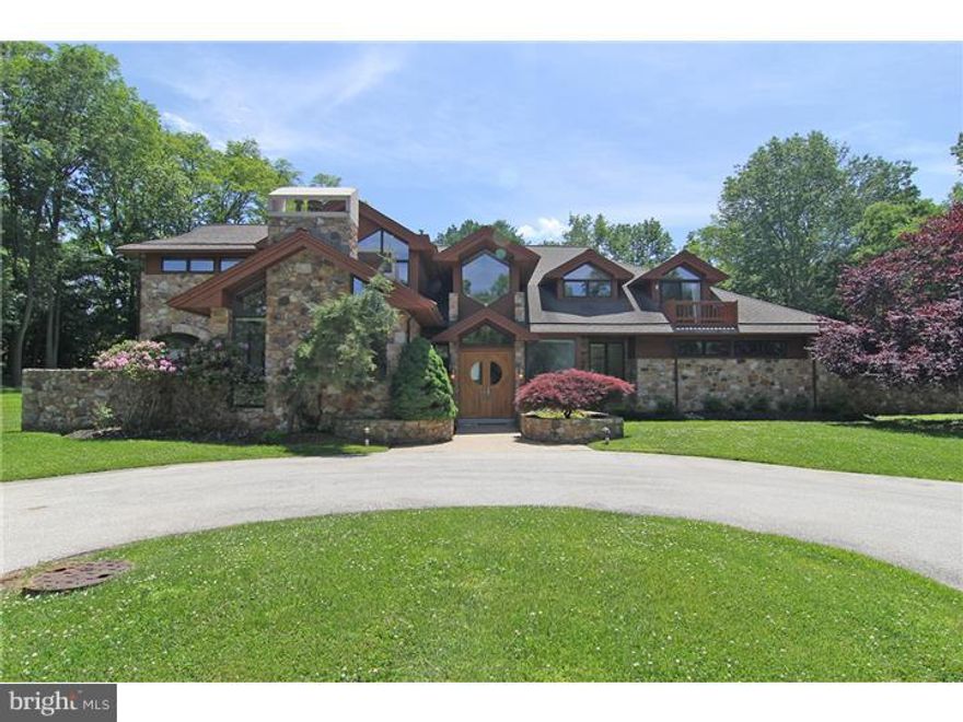 Expect the unexpected.  This is a  true  modern day castle. The first impression is huge open entertaining space yet the home gives the residents a warm comfortable feeling.  Custom built with quality craftmanship and numberous architectural details that will delight. Rich wood built in furniture, arched windows and stone walls make an exquisite dining room.  The exterior stone walls make the inside  sound proof to exterior noise yet the large windows fill the house  with light and the home offers bocolic views of surrounding landscape.  Must see in person to admire this quality and value.