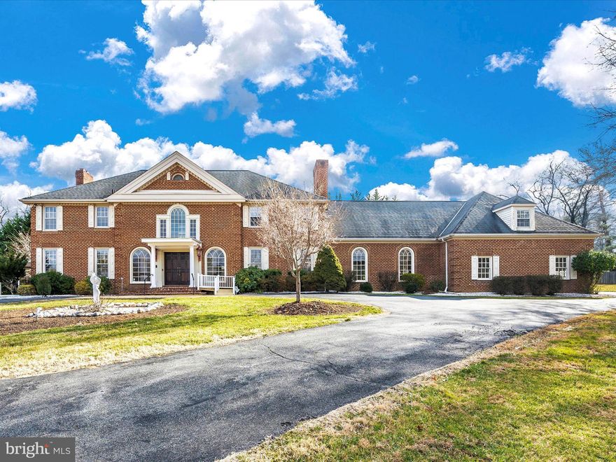 This  elegant colonial is situated on 2.17 stunning acres in the highly-sought after River Oaks Farm Community with a majestic iron gate and fence, five bedrooms, five full and one-half baths, and a fully-finished walk-up basement as well as a side walk-out entrance.  A private circular driveway leads to an attached three-car garage. High quality construction and attention to detail are evident immediately upon entry. Embossed in elegance and colonial vintage charm, the two-story front entrance welcomes all with bright Palladian-style windows, a gleaming chandelier, wood flooring, and custom millwork. The traditional floor plan offers formal living and dining spaces of palatial size, ideal for entertaining guests and more intimate family living. The family room has beamed, vaulted ceilings and enjoys an enormous, industrial-sized wood-burning fireplace on a stone wall setting. The family room ascends to a loft conversion with ensuite, ideal for accommodating extended stay guests. The eat-in kitchen features an incredibly unique wood burning stove on a full-brick wall, granite countertops, double wall ovens, and a large center island.  Enjor all four seasons and enjoy the extensive and picturesque yard from the sun-drenched four-season room designed for year-round living and relaxation. The main level also includes a powder room, butler’s pantry, a laundry closet, and multiple points of access to the backyard. The upper level has five generous size bedrooms and four beautifully designed bathrooms. The primary suite includes a huge sitting room, walk-in closet, and luxurious bathroom.
House has Tesla solar panels allowing saving for this ALL electric powered home.