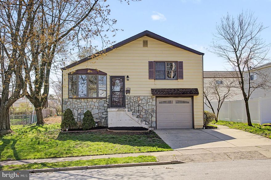 Welcome to a beautifully updated three bedroom, one and a half bathroom split-level home in the heart of Glenside, where style, comfort, and location come together in a way that’s hard to find. From the moment you arrive, the charming stone front, classic bay window, and convenient driveway parking paired with a one-car garage set the tone for what awaits inside.
Step through the front door into a bright and inviting living room, where a large bay window floods the space with natural light and brand new luxury vinyl plank flooring creates a warm, modern feel. The open flow leads seamlessly into a thoughtfully remodeled kitchen that truly serves as the centerpiece of the home. Here you’ll find high-end cabinetry, granite countertops, stainless steel appliances, a gas range, built-in microwave, oversized sink, and dishwasher—all complemented by a stylish tiled backsplash, recessed lighting, pantry storage, and a breakfast bar perfect for casual dining or entertaining. A second bay window at the rear adds even more natural light and charm.
Upstairs, three generously sized bedrooms offer comfort and privacy, each featuring fresh paint and brand new carpeting. The fully renovated hall bathroom is finished with a sleek granite-topped vanity, tiled flooring, and a beautifully designed tiled shower with a clean, modern finish.
The lower level provides additional living space with brand new luxury vinyl flooring and fresh paint—ideal for a family room, home office, or flex space. A convenient half bathroom and direct access to the garage add functionality and ease to everyday living. The basement houses the laundry area and offers additional storage as a dedicated utility space.
Out back, enjoy a covered porch with rear entry—perfect for relaxing, grilling, or enjoying quiet evenings outdoors.
What truly sets this home apart is its unbeatable location directly across from Ardsley Park, offering access to baseball, soccer, and softball fields, tennis and basketball courts, a playground, and walking paths. You’re also just minutes from the train station, public transportation, and the vibrant restaurants and nightlife that make Glenside so desirable—all while being a short commute to Philadelphia.
Homes that combine this level of updates, space, and location rarely come to market—and they don’t last. This is one you’ll want to see before someone else calls it home.