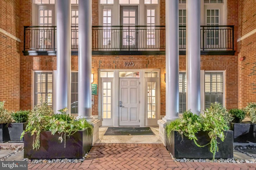 Charming 1BR/1BA condo ideally located in Old Town!  This 2nd floor, corner-unit features soaring 9 foot ceilings with double crown molding, and is one of the largest 1BR floor plans in the building.  This expansive open floor plan features hardwoods throughout the main living quarters and carpet in the bedroom. The kitchen opens to an oversized living area and a wall of windows overlooking the courtyard, making it the perfect dynamic space to relax, host, or work from home!  Primary bedroom features a walk-in closet and plenty of room for larger-sized pieces of furniture (king bed w/frame pictured). Balcony view beautiful view off of living area! HVAC, Refrigerator, Dishwasher, Washer and Dryer all replaced within the past 5 years! Garaged parking space conveys with unit and is easily accessibly, making grocery runs and getting in & out a breeze! Old town location walkable to the waterfront, Harris Teeter, Trader Joe's, Montgomery Center Shopping Mall, and all the charming sights and feels that Old Town entails.  A must see!