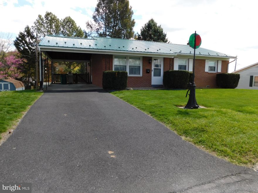 All brick starter home in low traffic neighborhood, close to downtown, schools, hospital and so much more. Some fresh paint and new flooring would make this home sparkle again.  Mostly finished walk out basement with family room, wood stove and storage room.  Outdoor space includes a fenced yard for the dogs, a deck for summer picnics, a shed for your lawn/snow equipment and the oversized carport will keep you and your car dry in rain and snow.  This is an estate sale and is being sold as is, no repairs will be completed.