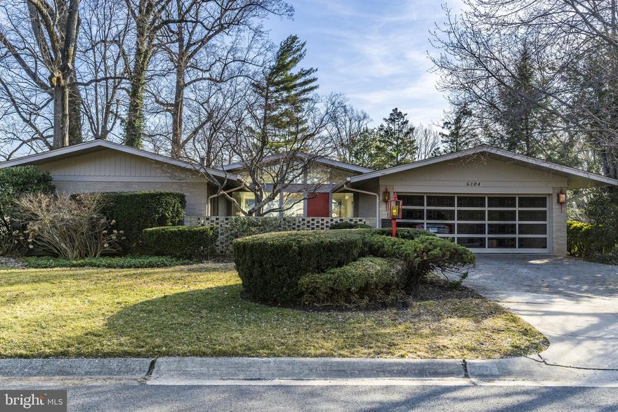 Come view this magnificent mid-century modern masterpiece. From the moment you step foot on the front patio the original accent wall, large window panes, and gorgeous original garage door hint at something spectacular within. This bright architectural dream was respectfully renovated in 2018, and pulls light in through the numerous picture windows. However, the interior isn't the only show stopper. Take advantage of the upcoming summer and enjoy al fresco dining on the new floating deck while admiring the serene, verdant, a fenced in back yard. The chic renovated kitchen, including newer stainless steel appliances, leads into the family room creating a bright and open floor plan. The main floor also includes 4 bedrooms, 3 bathrooms, a dining room, and a living room. The enormous bright walkout basement is complete with generous storage space, a bedroom, a bathroom, a wet bar, and a massive recreation room. Situated less than 2 miles from Downtown Bethesda and walkable to Walt Whitman HS and Pyle MS. Understated elegance at level is hard to find.