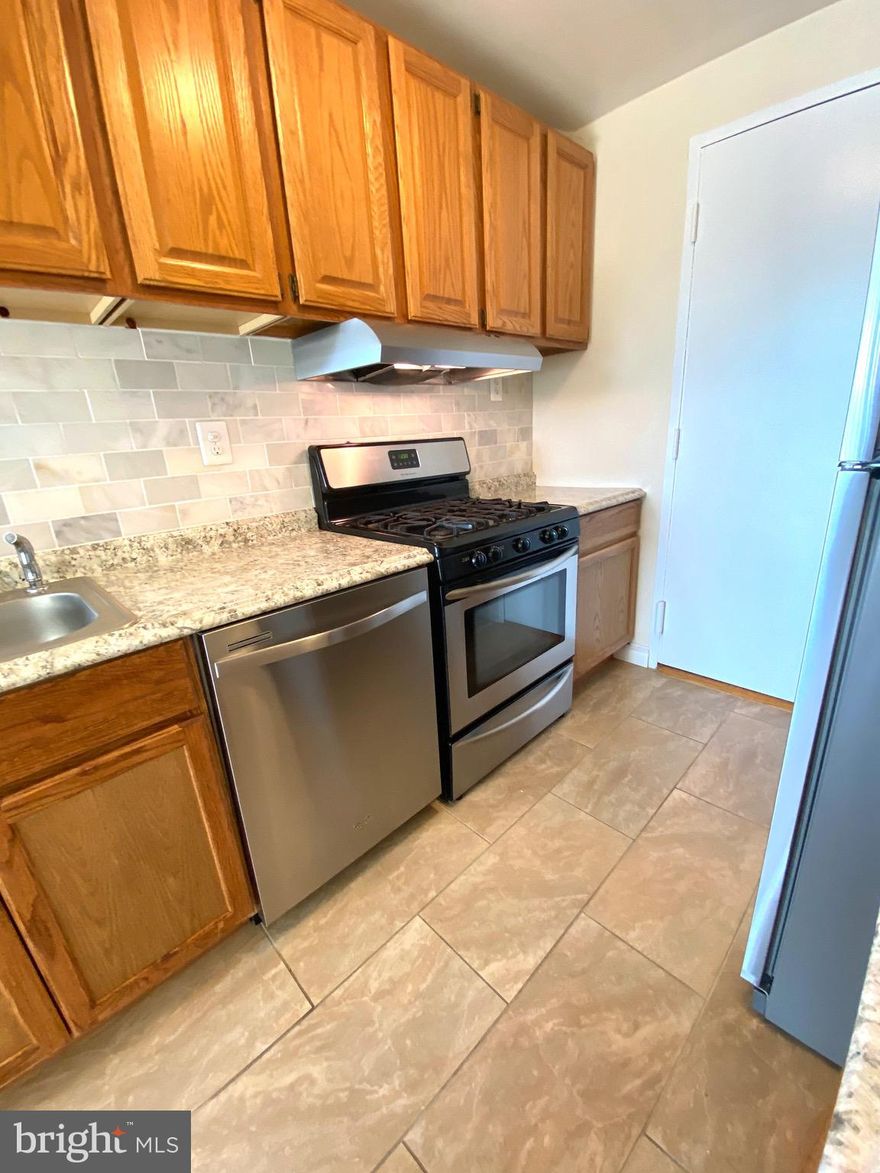 Fantastic sunny and bright, renovated, move-in ready, two bedroom, two full bath condo in popular Grosvenor park just minutes to redline Metro.  Beautifully renovated kitchen with stainless steel appliances, backsplash, new flooring. Updated bathrooms. Open floor plan with condo kitchen/dining room/living room and big windows with a beautiful view of trees and  the lake! High level, 11th floor with no noise and traffic views. Very rarely available CORNER UNIT! !  Building amenities include, grocery, salon, pool, tennis, exercise room and more!A must see!