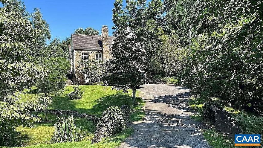 121 and 123 Cameron were sold as one. Two homes, two separate parcels totaling 0.81 acre. 123 is a European-feeling stone cottage with enclosed courtyard set on a generous 1/2 acre lot in the heart of the University of Virginia. Walk easily to the Rotunda or any of the stadiums, or enjoy hiking, biking or running on miles of nearby trails. Enjoy the living room with tile fireplace and abundant natural light throughout the day. The charming dining room also features a tile fireplace. The inviting kitchen and bathrooms were renovated in 2021. Main floor primary suite, generous dressing room or fourth bedroom. The well-appointed spa-like primary bathroom boasts a spacious tile shower, double vanity, heated tile floor. The second level offers two additional bedrooms, bathroom, laundry, ample storage, playroom or flex areas. The terrace level is partially finished for workout/studio/office space, plus storage room. The private garden-like yard, with stream, mature and ornamental trees and flowering bushes. The cottage features two bedrooms and one bath, vaulted living area, stone fireplace, hardwood floors. 121 is a charming 2 bedroom 1 bathroom stone cottage with vaulted ceiling and stone fireplace.,Painted Cabinets,Wood Cabinets,Fireplace in Dining Room,Fireplace in Living Room