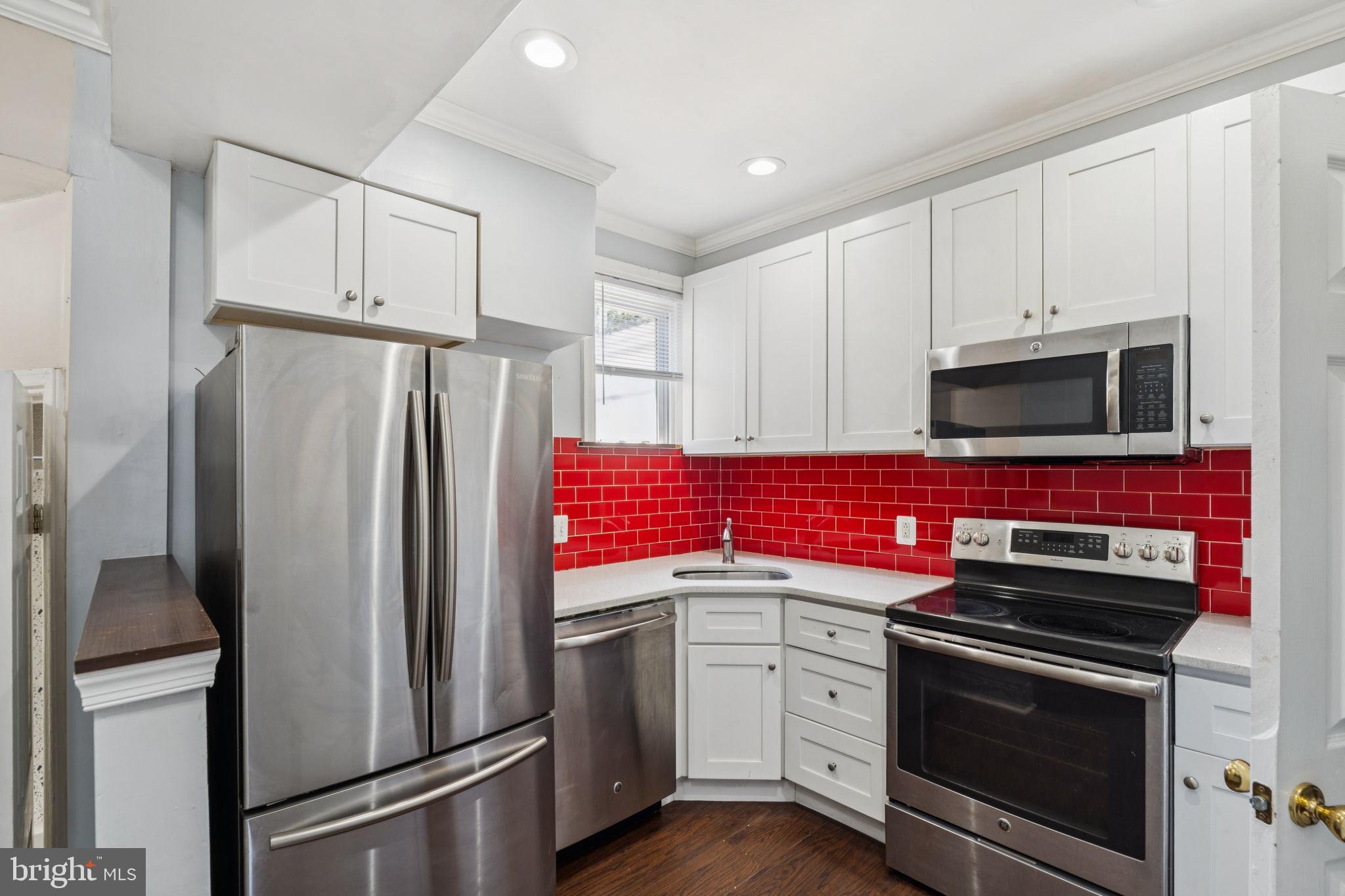 This sunny second-floor 2-bedroom, 1-bath apartment offers a bright and comfortable layout in the heart of North Philadelphia. Each of the two spacious bedrooms is filled with north and south exposures, and includes its own closet, providing ample storage and privacy. The separate living area and kitchen create a practical layout, with the washer and dryer conveniently tucked in a closet near the kitchen. The kitchen features all-electric stainless steel appliances, a subway tile backsplash, and plenty of cabinet space. With high ceilings, recessed lighting, and central air, this home offers both comfort and convenience. Located just steps from SEPTA bus route 23 and within walking distance to the Broad Street Line, it’s a perfect choice for students or professionals looking to be close to Temple University. Make this unit yours!