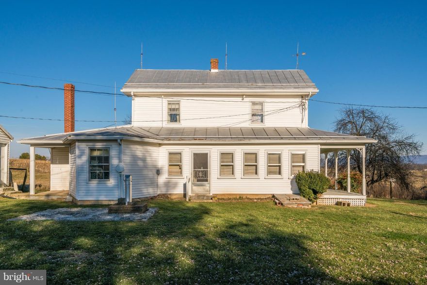 First time on the market.Site offers new building site in tall timber woods w/potential of 360 degree views overlooking approx. 40 AC of crop land & 55 AC of hay/pasture land.Circa 1896 modest farmhouse suitable for guest/tenant use.Large bank barn in need of some work.Modern all metal run in machine shed.Surface stream near road.In field water fountain.Beautiful farm property w/loads potential.