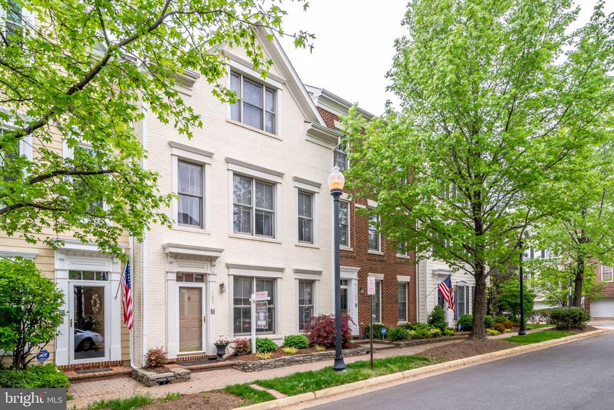 Elegant & spacious OPEN CONCEPT brick town home in quiet & very charmingJames Wren community! Main level boasts large living room w/hardwoods, crown molding and, stately columns flanking dining room. Eat-in, gourmet kitchen shines with new stainless appliances, granite counter tops, 42" cabinets, gas cooktop, pantry and double ovens! Kitchen opens to cozy family room with gas fireplace & mantel.  Eat-in kitchen area offers custom built-ins providing amazing storage, functionality &versatility w/glass-front cabinets, storage drawers, a counter space & large lower cabinets.  Laundry room is just steps down from kitchen, leading to the 2-car garage. Upper level has master bedroom suite w/walk-in closet, new frameless shower door, double vanities, deep soaking tub & loads of light. Top floor offers 2 unique bedrooms with walk-in closet, vaulted ceiling and another full bath. Either of these rooms can  serve as an office or additional recreation space. Relax w/your morning coffee & paper on the private, enclosed deck off the kitchen.  Enjoy all that Falls Church City has to offer -- walkability to Starbucks, schools, shops restaurants,  churches, parks, famous farmer's market, State Theater & metro!