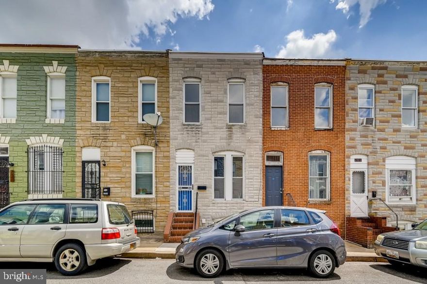 REDUCED PRICE**MOVE-IN READY OR **EXCELLENT INVESTMENT OPPORTUNITY**.  Previously rented at $1,400/Mo.  Delightful Interior 2 Bedroom, 1 Bath Townhome on a quiet side street. Within walking distance to all of the amentities that Remingon and Hampden have to offer. Super cute and functional with laminated wood flooring  throughout! Comfy light-filled Living Room. Kitchen featuring beautiful white cabinetry, SS appliances, range, granite counter tops with bright backsplash, new cabinetry and fixtures with table space. ***BONUS ROOM*** off of kitchen can be used for Guest Bedroom, Office or Pantry - storage. UL Features updated Bathroom with standup shower/glass sliding doors, and ceramic tile. Two spacious Bedrooms with laminated wood flooring and lots of natural light. Large unfinished partially lighted basement with Washer and Dryer - Great for storage, office. Rear fenced yard for your furry friends to enjoy. Located close to Johns Hopkins Homewood Campus, MICA, Remington Row, I83, public transportation and 2 miles from Druid Hill Park & Maryland Zoo.  Walking distance to Famous R House, Paper Moon Diner and Charm City Cakes, local restaurants and MORE!  Move-in Ready. See if you qualify for the "Live Near You Work" Grants!