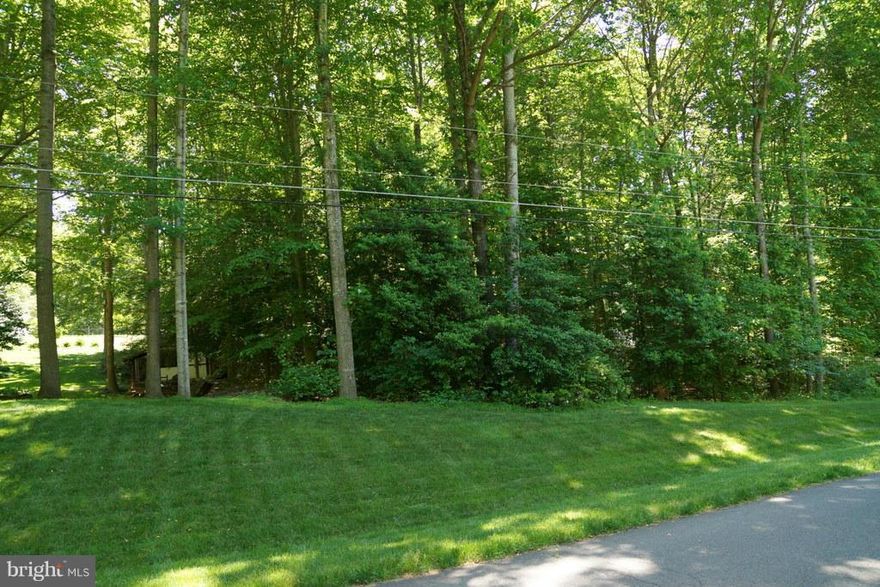 SMALL COMMUNITY OF LARGE HOMES ON 1+ WOODED ACRES. THIS HOME SITE IS ON A CUL-DE-SAC AND IS COMPLETELY WOODED. SEWAGE DISPOSAL CERTIFICATION  LETTER IS AVAILABLE. LOT HAS BEEN APPROVED FOR A 4 BEDROOM PERC AND THE COUNTY HAS PROVIDED THE DRAIN FIELD AND WELL LOCATIONS.