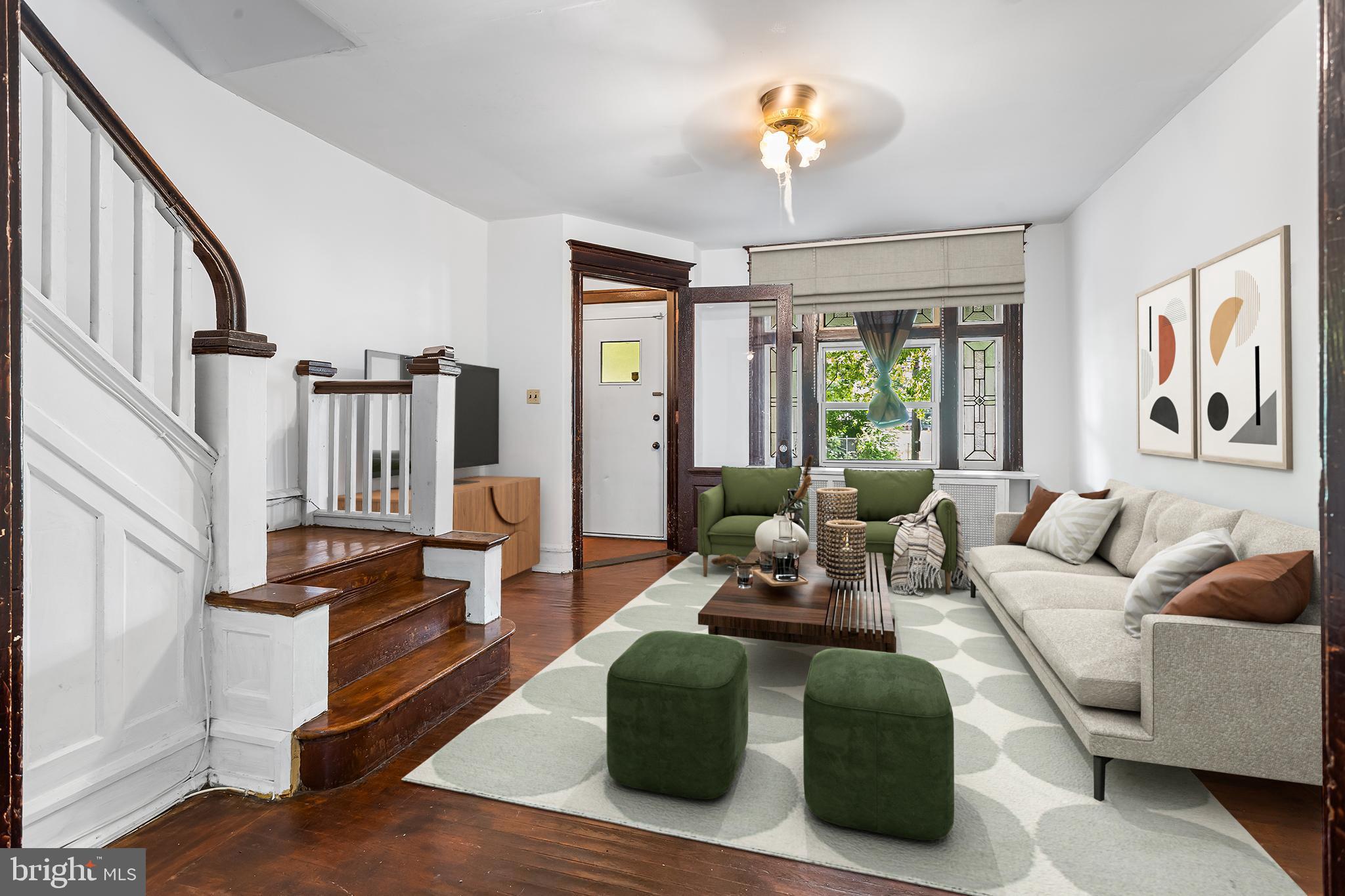Fantastic value in the rapidly appreciating Mantua neighborhood of West Philly. This lovely home has some wonderful original detail and character, and is fully move in ready. Entering up the the front steps to the porch which is framed by the original stained glass window, you can envision many lazy days and evenings overlooking whiling away the time over looking the front yard. A rain barrel has been installed that makes gardening and maintenance of the front yard super easy. The front vestibule serves as a barrier to the elements and storage opportunity for coats and other items. The main living room, also framed by the original stained glass window and the original banister and turned stair case, is every large and will accommodate many entertaining options, along with the dining room that will seat at least 6 comfortably. The eat in kitchen has an expansive amount of counter and cabinet space, as well as an abundance of natural light from the three windows. The rear vestibule off the kitchen further provides insulation for the elements, storage for pantry and other items. The rear yard features a garden plot with a thriving raspberry bush the produces bags and bags of raspberries each summer week. The upper floor has large main bedroom, large rear bedroom, spacious middle bedroom perfect for office, and full size bathroom with tub and shower combination, and newer skylight. The full basement feature a french drain system ensuring any dampness or mooisture will not be an issue, as well as the washer, dryer, and a walkout door to the rear yard. Make your appointment today. You will not be disappointed. Furnished photos are digitally staged.