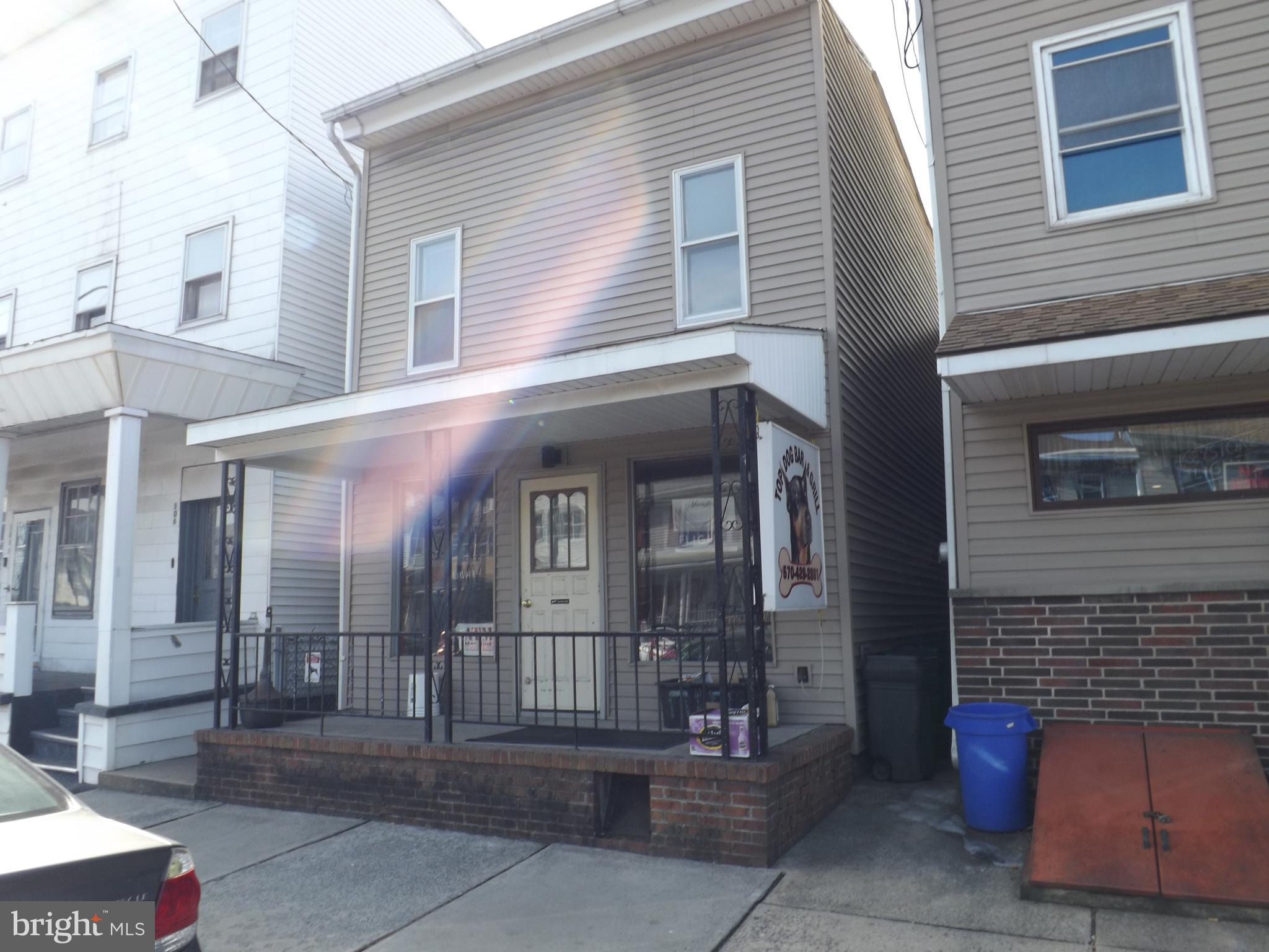 This is a well established Bar and Grill ( Top Dog) on the main throughfare of Saint Clair Borough. The sale of this business includes two separate parcels/two separate buildings side by side for one sales price. The one side consists of the large bar area and the kitchen/grill. The other adjacent attached building is the seating and billiard area. The upper floor of this business establishment features plenty of living space. The second floor includes a nice size kitchen, a large living room, a full bathroom, and a bedroom. The adjacent attached building consists of two finished rooms and an unfinished room. There is ease of access through the interior of both of these buildings to the entire first floor and second floors, being these buildings are attached and opened up in the interior to each other. The liquor license is also included in the sales price.