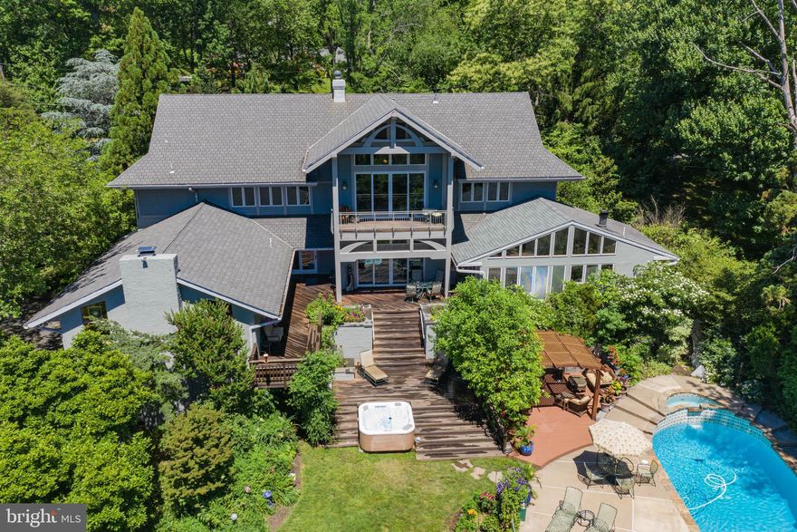 1661 Graham Rd in prestigious Meadowbrook is situated in the most enchanting garden. The sense of amazement starts as you walk down the front path past the Chinese Chestnut trees and listen to the waterfall flowing to the coi pond. The  distinctive Arts and Crafts facade with porch and 2 story window set the tone for delight inside.  The two story entrance is flooded with light.  Off the foyer is a generous sized dining room with fireplace is drenched in sunlight from the bay window.  Step down to the  comfortable formal living room that flows into the family/entertainment room. This room is a versatile space with pool table , fireplace, wet bar with wine cooler, entertainment area and access to the rear deck. An updated powder room and access to the attached 2 car garage is located in this wing of the home. The kitchen is the heart of the home. Custom Cabinets with exquisite granite counters, wall oven, built in range and oven, built-in microwave, 2 miele dishwashers , large dining area and sliding door access to the outside (what a view from this space) The first floor master suite is an indulgent space.  Built in cabinetry define the bedroom space. The master bath boasts heated floor,steam shower, multiple shower heads, double sinks, Toto washlet toilet , Blue Baja granite, vanity area and plenty of storage. The Sun-room attached to the master suite is currently an exercise room with 2 walk-in closets and access to the outside deck.  The Master suite includes a  Tub room  with Blue Baja granite, Swarski crystal lighting,heated floors, the whirlpool tub is all part of your own private oasis. The large walk-in closet is the icing on the cake. This wing includes an efficient guestroom with powder room  and storage closet. The turned staircase  off the foyer leads to the 2nd level. Two good sized bedrooms with wonderful windows large double closets and each has a ladder to a secret room in the attic. A hall bath complements both rooms.  the 2nd level includes another Family Room that boasts an arts and crafts area/art studio space with wet sink, siting area and an upper level currently used as an office with access to an incredible balcony with the most glorious view in Meadowbrook. The lower level includes a wine cellar for 12,000 bottles (an old bomb shelter that is temperature controlled) Cedar closet, work shop,laundry area,and powder room that is easily  accessible from the outside  pool and hot tub. That brings us to the back yard - your own personal playground surrounded by your own arboretum.  There is a large deck that most rooms on the 1st floor have access. A hot tub at the foot of the deck steps is wonderful all year round.  Relax by the built in swimming pool under the wisteria covered cupola. A fountain made of musical instruments once featured in the Philadelphia flower Show is a treasure that can't be missed. Walk thru the trail in the woodland specimen tree garden to a hidden gazebo. Two large sheds, one for garden equipment and one for pool entertaining and storage. This home is like a Vacation hideaway and  is waiting for you to make your own. Take advantage of all the area has to offer - close to Whole Foods, Trader Joes, Abington Art Center, Abington Hospital, Abington Library, Shopping, Dining, Entertainment, and the regional rail stations with easy access to Center City and the Airport. The Award-winning Abington School District is also plus of living in the Township. Come see this special home and make it yours!!