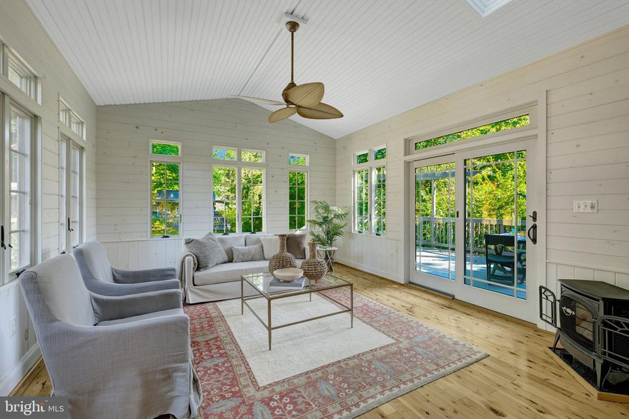 Unique and one-of-a-kind custom-built home on Orchard Drive in Fairfax City blends a traditional, simple design with comfortable, cozy and practical elements.  Built in 1994, the original owners put methodical thought into creating a home that has the timeless appeal of farmhouse simplicity and Victorian charm.  A covered front porch provides a welcoming entrance for guests or a perfect place for a short respite from the activities of the day.  Lighting and a ceiling fan provide the allure of sitting outdoors to share some peace with the natural setting.  The sweeping front yard provides a landscaped palette with hardscape and manicured areas highlighted with a circular patio area perfect for a bench shaded by a tree standing sentry.  Once inside the home, note the rich hardwoods on most of the main level, crown molding and chair rail architectural details, and chandelier and ceiling fan choices which add dimension and finesse to the farmhouse/Victorian feel.  Enjoy gathering, dining, relaxing and socializing in the intimate setting of the main level of this home.  The family room, breakfast room and kitchen evoke memories of spending time in a cabin or lodge.  With two tall arched windows, a brick gas fireplace, and a bay window to bring in natural light and provide a treelined view,  hours can be spent on this right side of the home forgetting that you are “in the city” minutes away from an abundance of amenities and activities.  A separate dining room is centered to the front of the house with a large window overlooking the porch.  Double doors close this room off from the kitchen.  The living or sitting room offers a view of the side yard and a perfect setting for a smaller group of four to discuss a good book or play a card or board game.  For a livelier foursome, step onto the rear sunporch/Florida Room that will soothe all troubles.  It’s solid pine interior has a soft paint color and a tropical style ceiling fan.  Casement style windows can easily be opened to provide a cool breeze during Spring and Fall seasons.  Use the Intrepid Direct Vent Gas Stove to heat the room in the colder weather.  From the sunporch, note the other special features of the yard.  Anderson sliding glass doors open to a deck with rear steps to the backyard.  At the rear, an amazing screened Gazebo has electric service perfect for children’s tea parties or adult wine sipping.  Nestled by the gazebo is a Shed (also with electricity) that has a potting porch with bench for the gardener in the family.  The shed has plenty of room to store tools on shelving while also creating a “She Shed” or “Man Cave” for alone time.  After enjoying some time on the deck, gazebo, or shed, return to the interior of the home, where two other levels with wonderful features await.  The upper level provides spacious bedrooms and a home office.  New neutral carpet has just been installed.  The front side of the home has a Primary Bedroom suite with a huge sitting room opening to the bedroom with 3 closets. The primary bathroom has a laundry closet with washer/dryer, a two sink vanity, jetted soaking tub and a separate room for the walk-in shower and toilet.  Leaving the Primary Suite, a home office and two large bedrooms with a two-vanity hall bathroom complete the upper level.   Wake up in the morning and view the clouds from the skylight at the top of the stairs.  If it’s a rainy day and you just want to chill at home, head down to the lower level.  The lower level boasts a rec room, a bonus room perfect for yoga/exercise equipment, an underground wine cellar, a bedroom with private bath and walk-in closet, and a small built-in service dry bar perfect for a mini microwave and coffee maker.